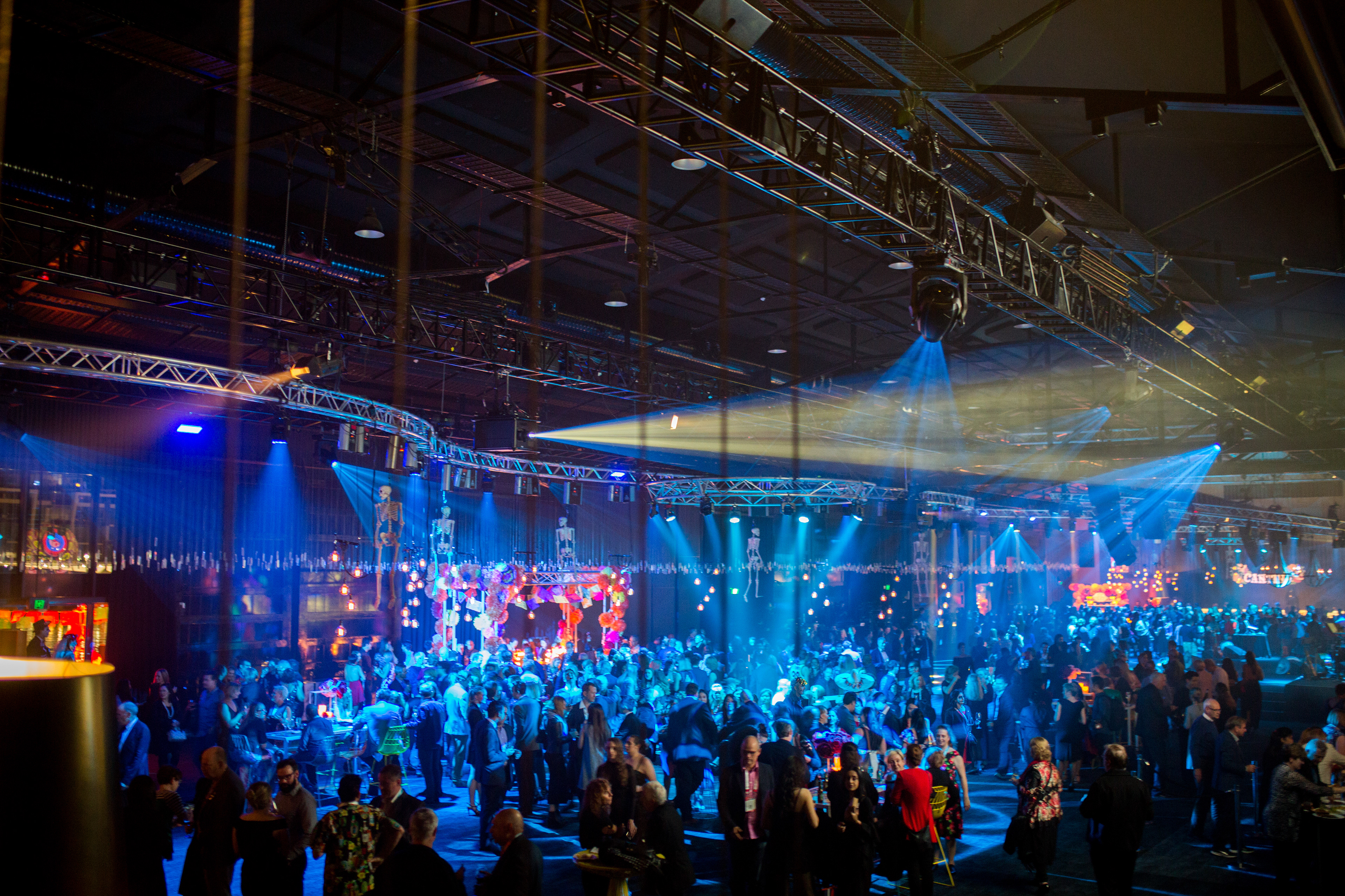 Large event venue illuminated with colourful stage lights