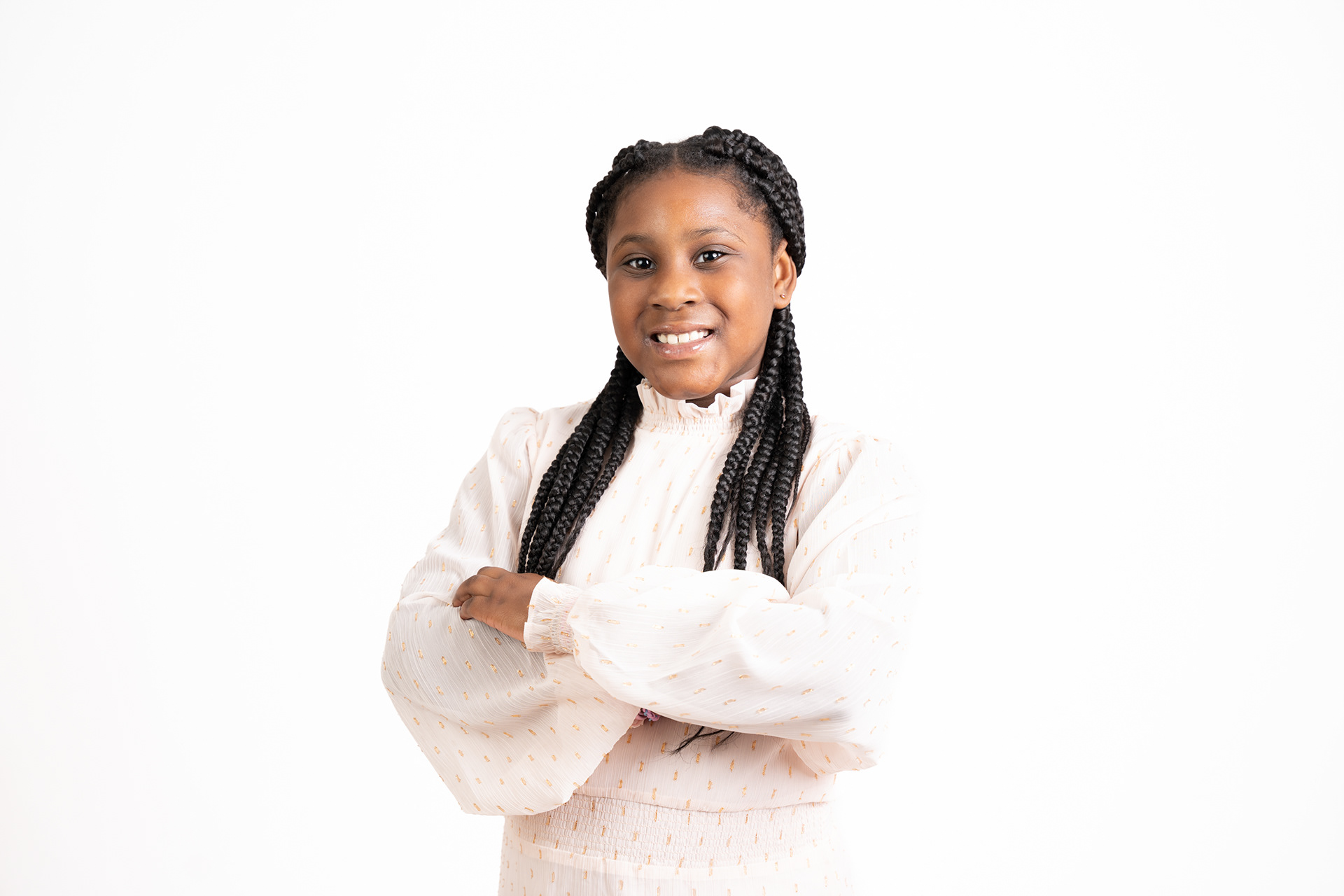 Smiling studio portrait in a white blouse