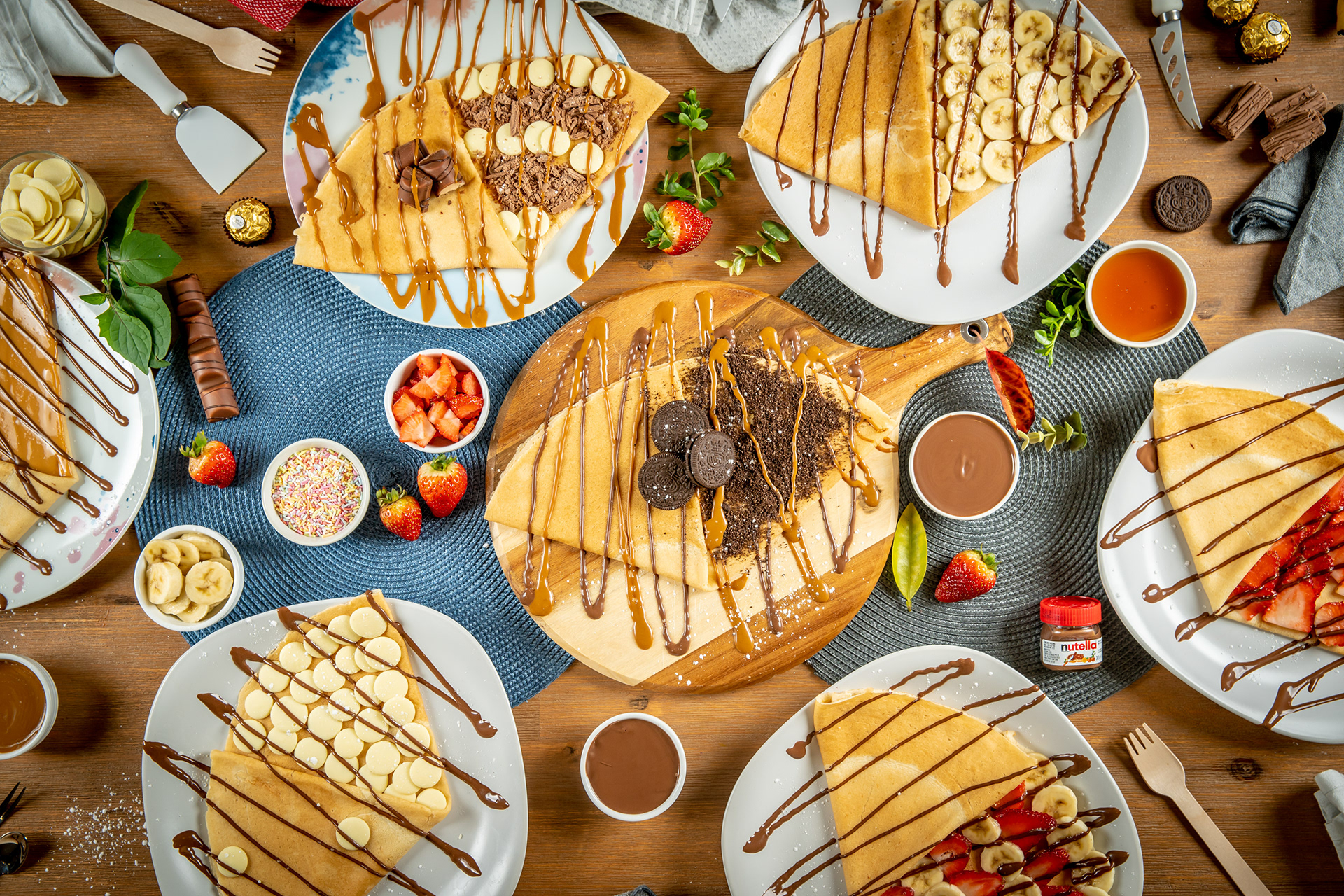 Overhead view of a shared meal with grilled food and side dishes