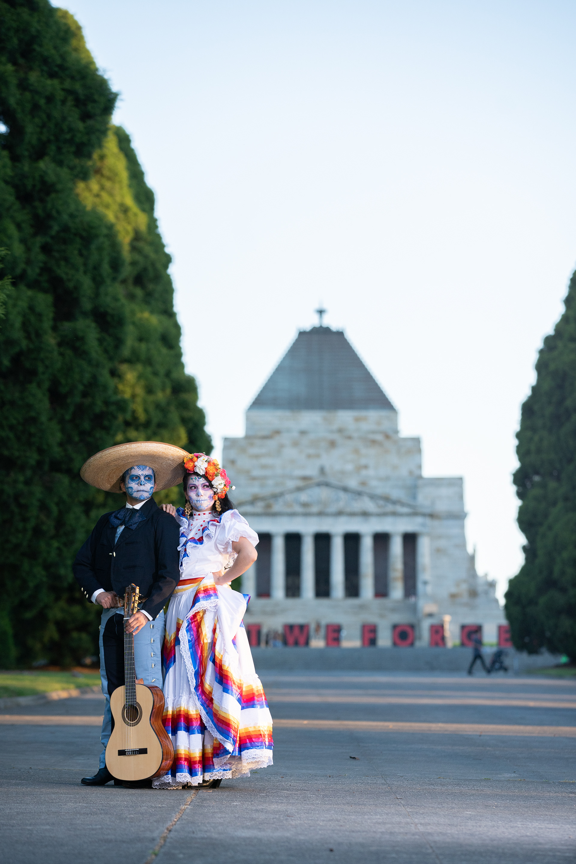 Couple posing in a formal garden