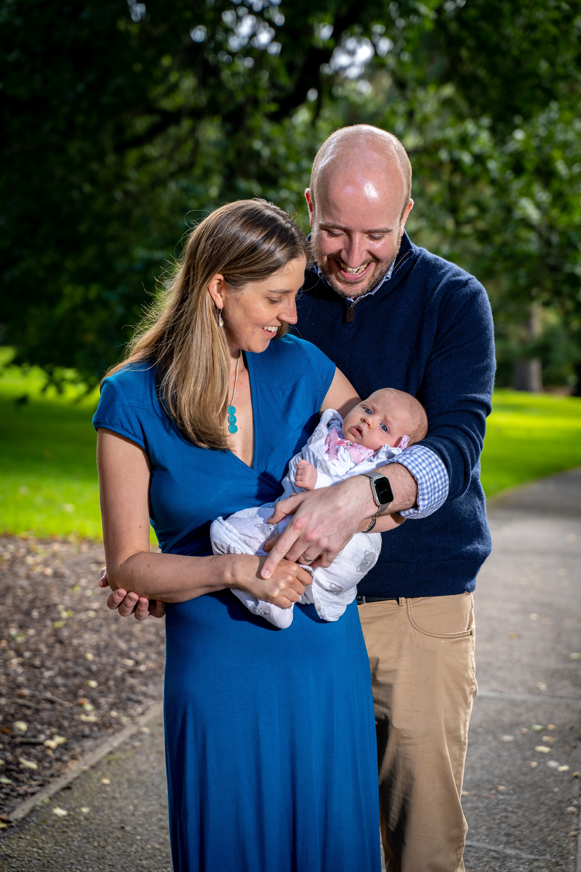 Parents holding their baby during an outdoor session