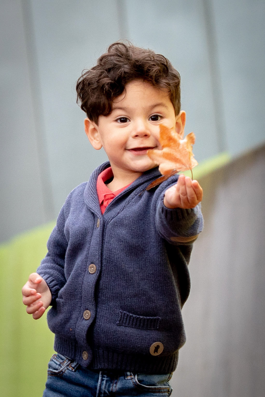 Child smiling in an outdoor portrait
