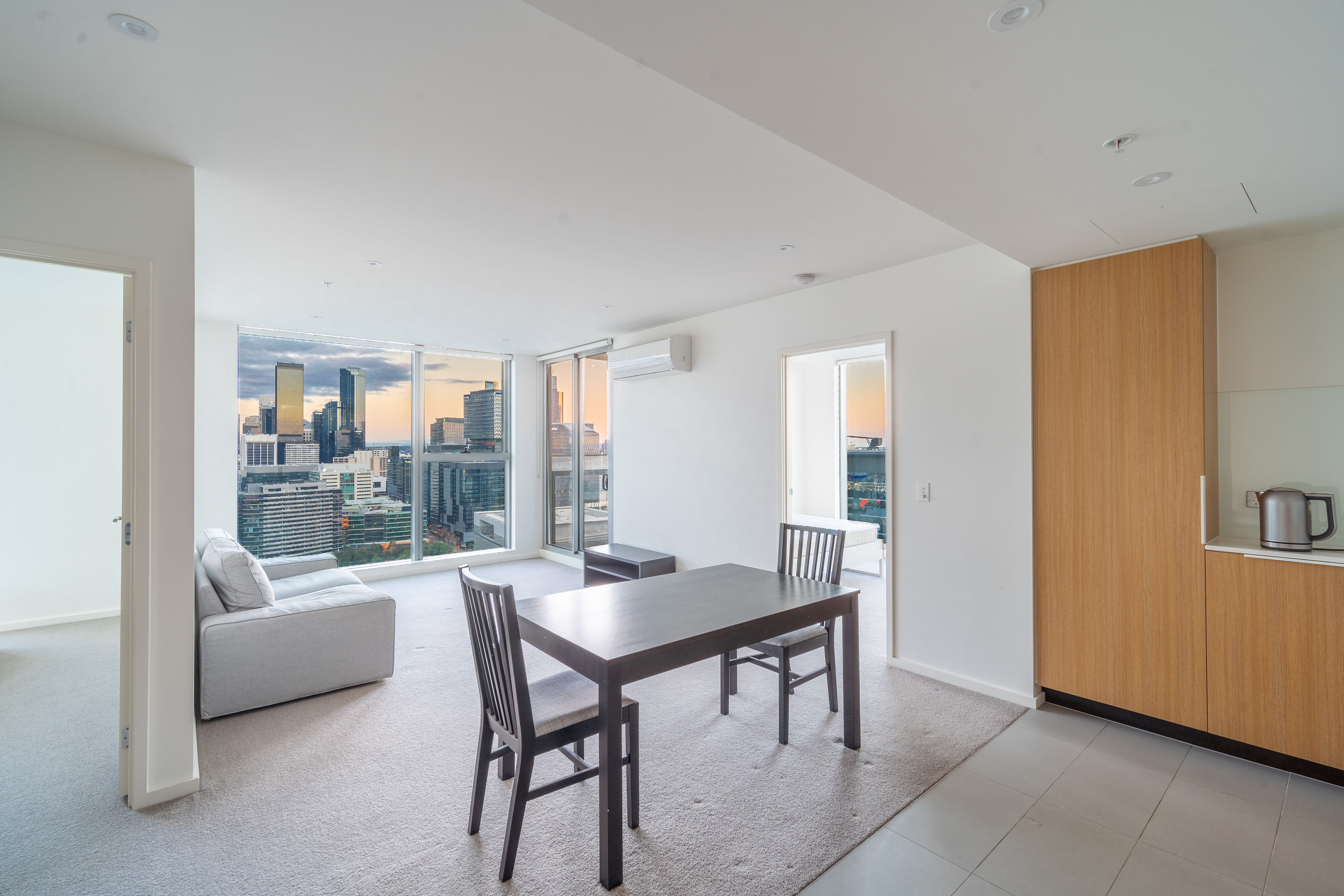 Modern kitchen and dining area with timber cabinetry