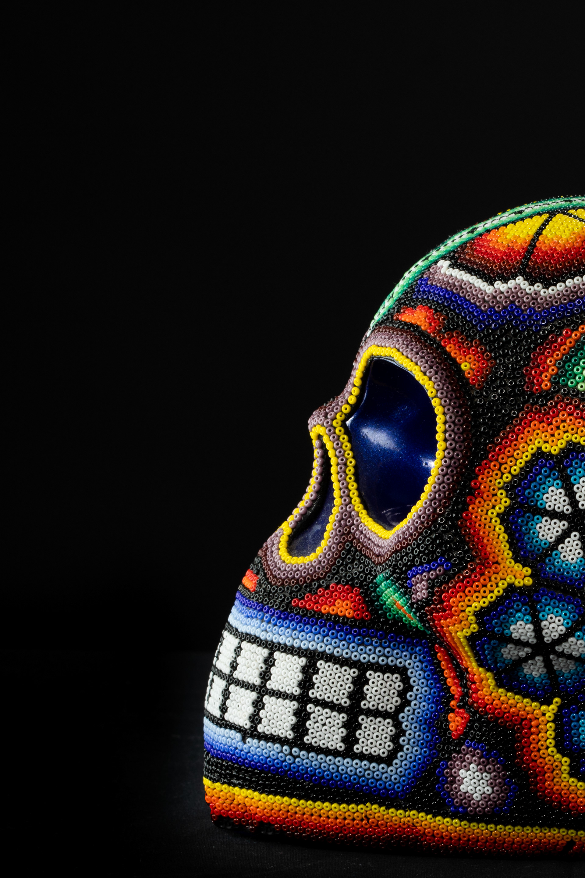 Side detail of a colourful decorated skull