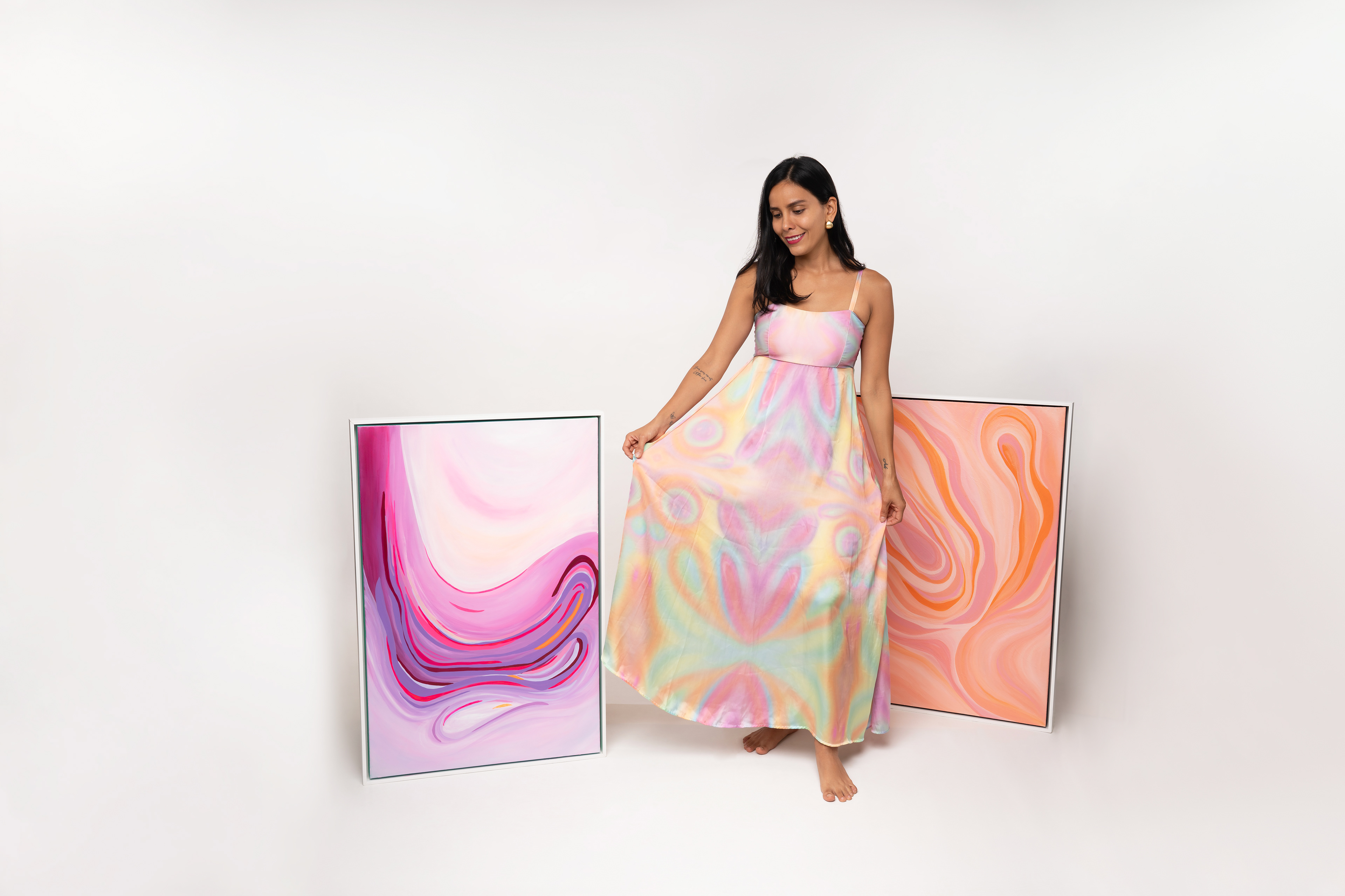 Studio portrait with flowing purple and pink fabric