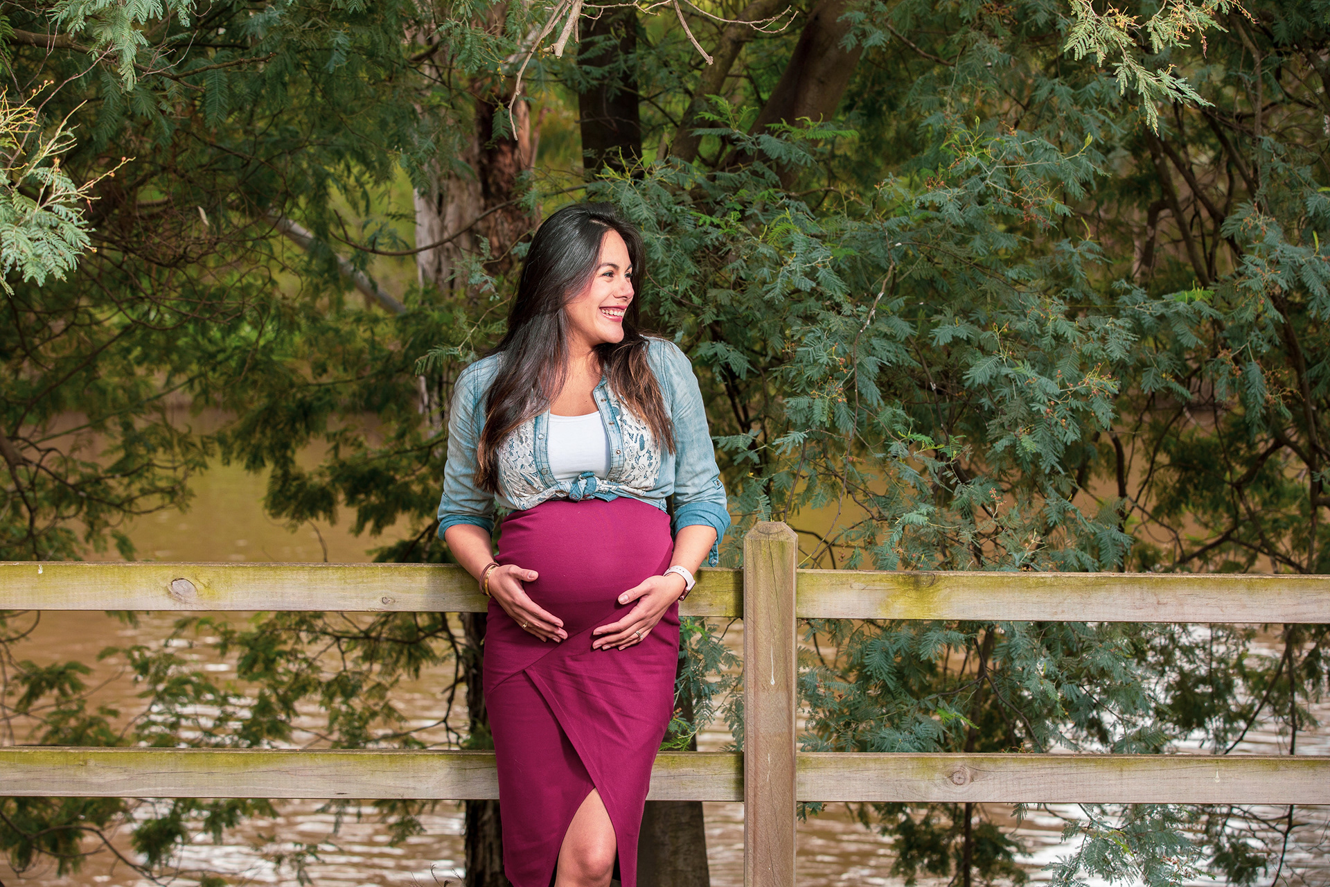 Couple posing during an outdoor maternity session