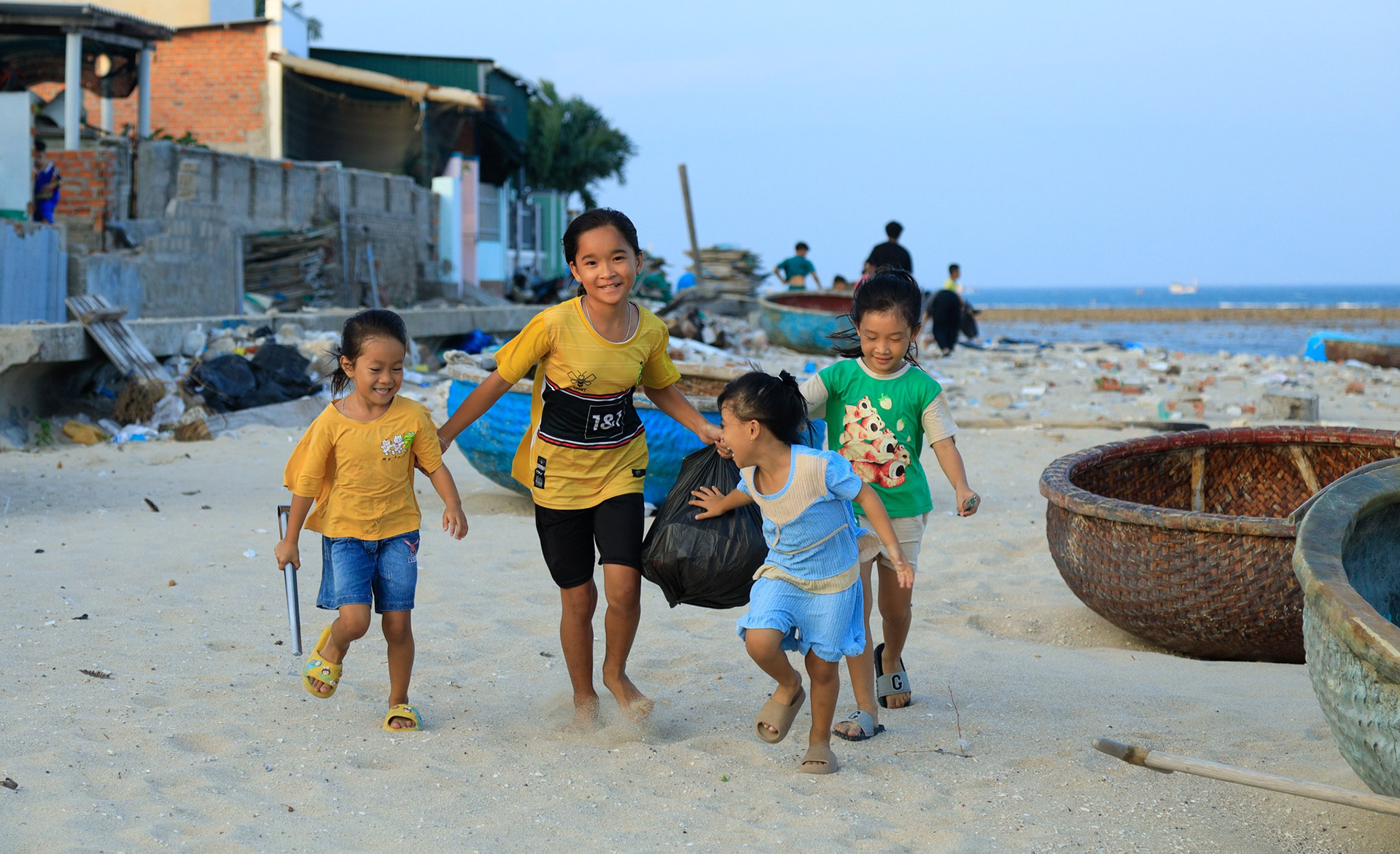 My favorite photo taken while we were cleaning up the beach with local kids.