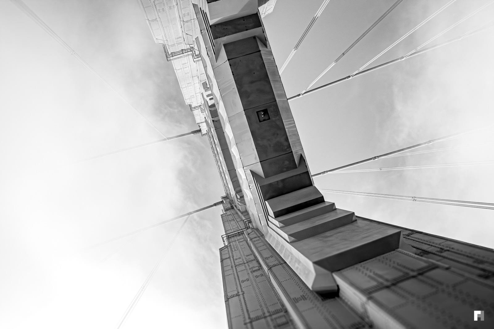 Cloudy Golden Gate through a sunroof.
