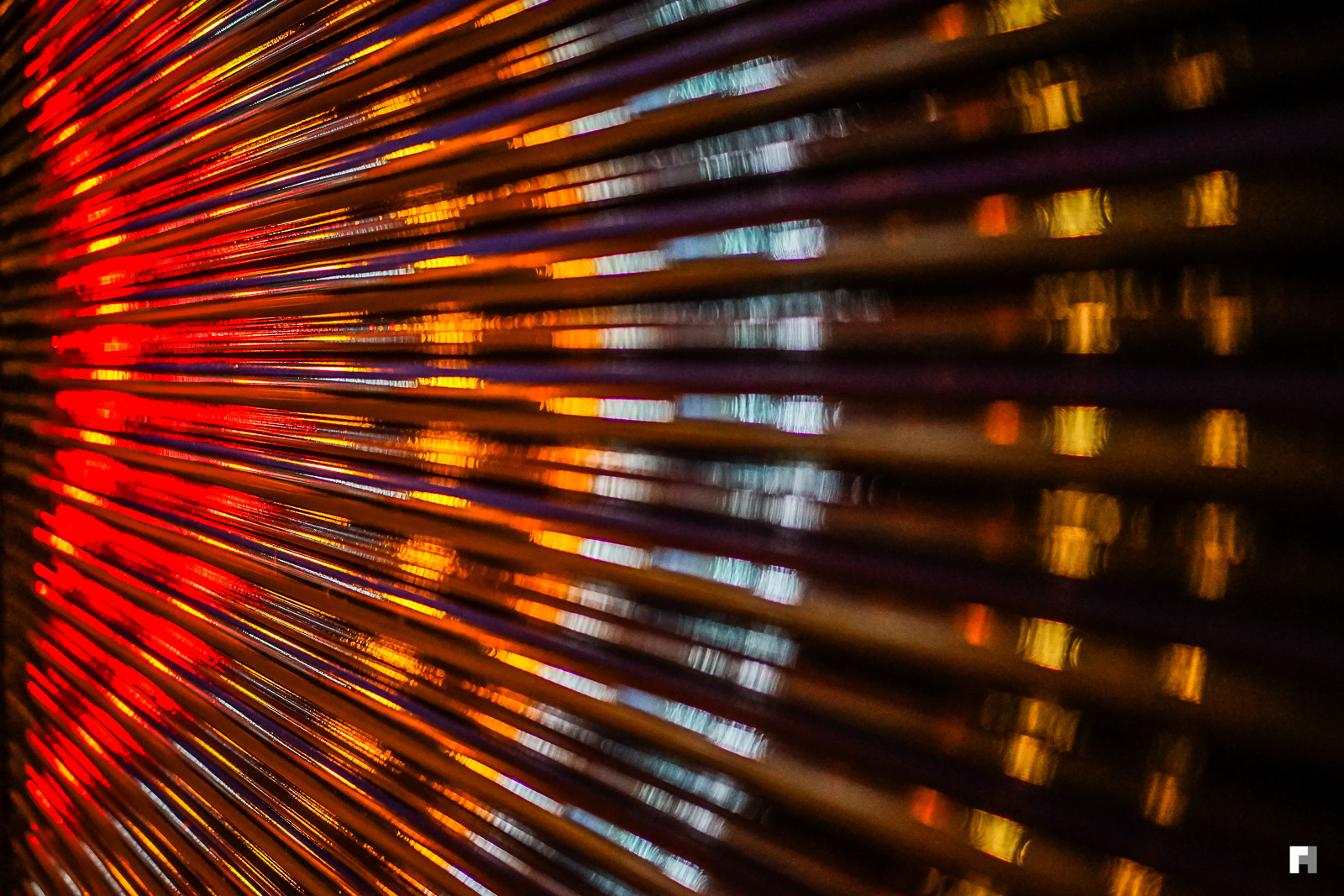 Traffic light reflections on garage door, London.