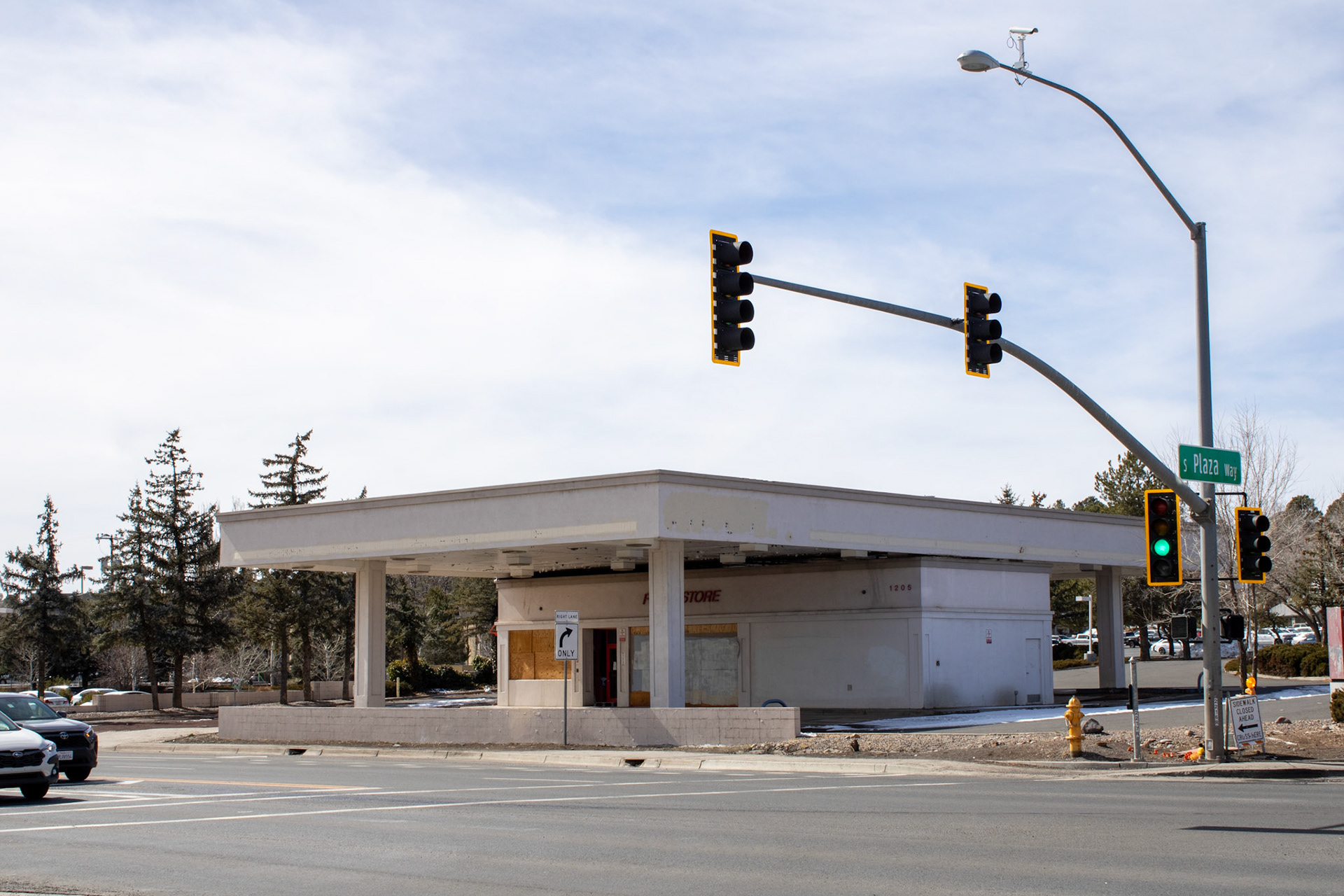Abandoned gas station on street corner. 