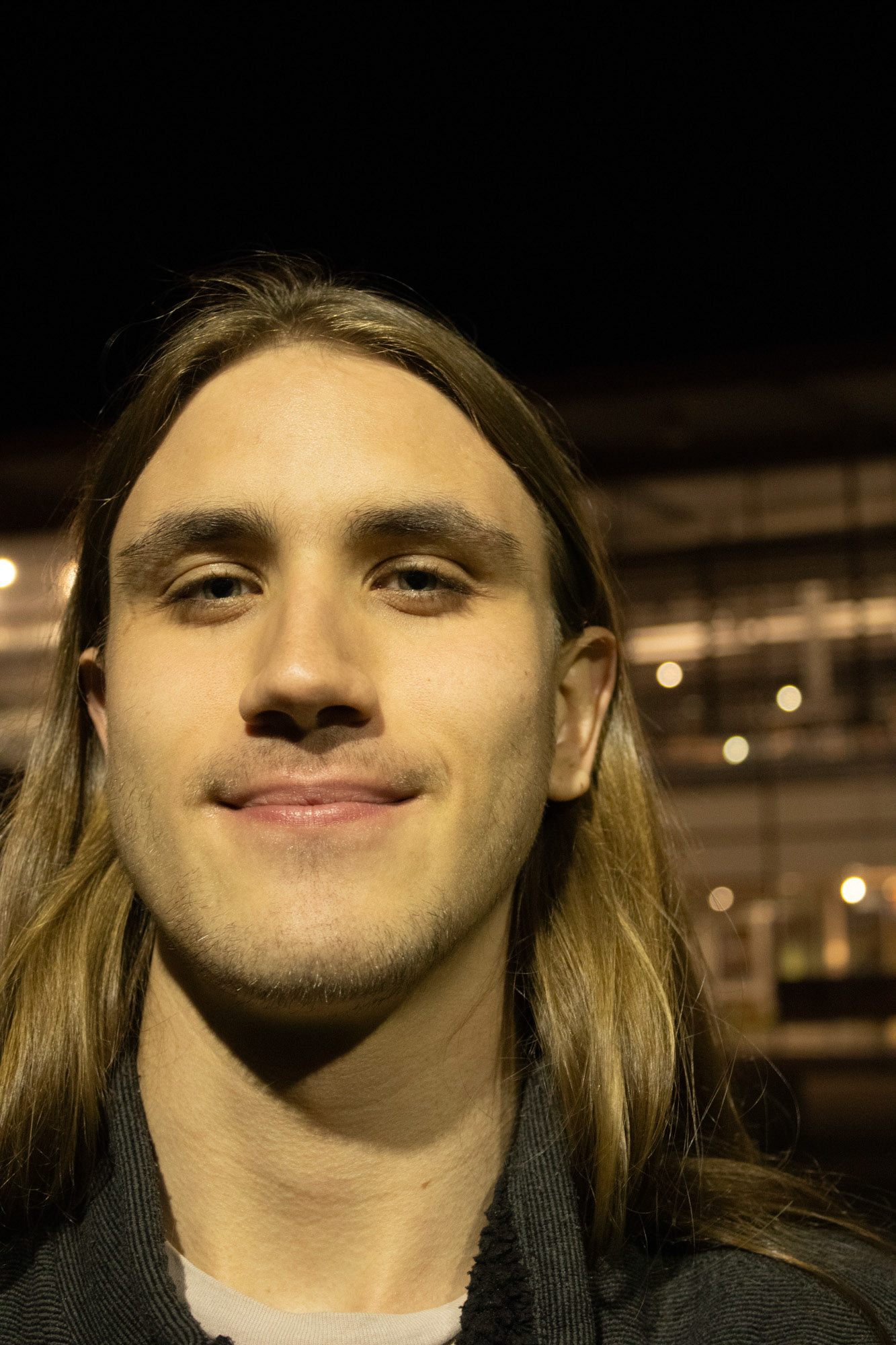 Man at night on the Northern Arizona University Campus. 