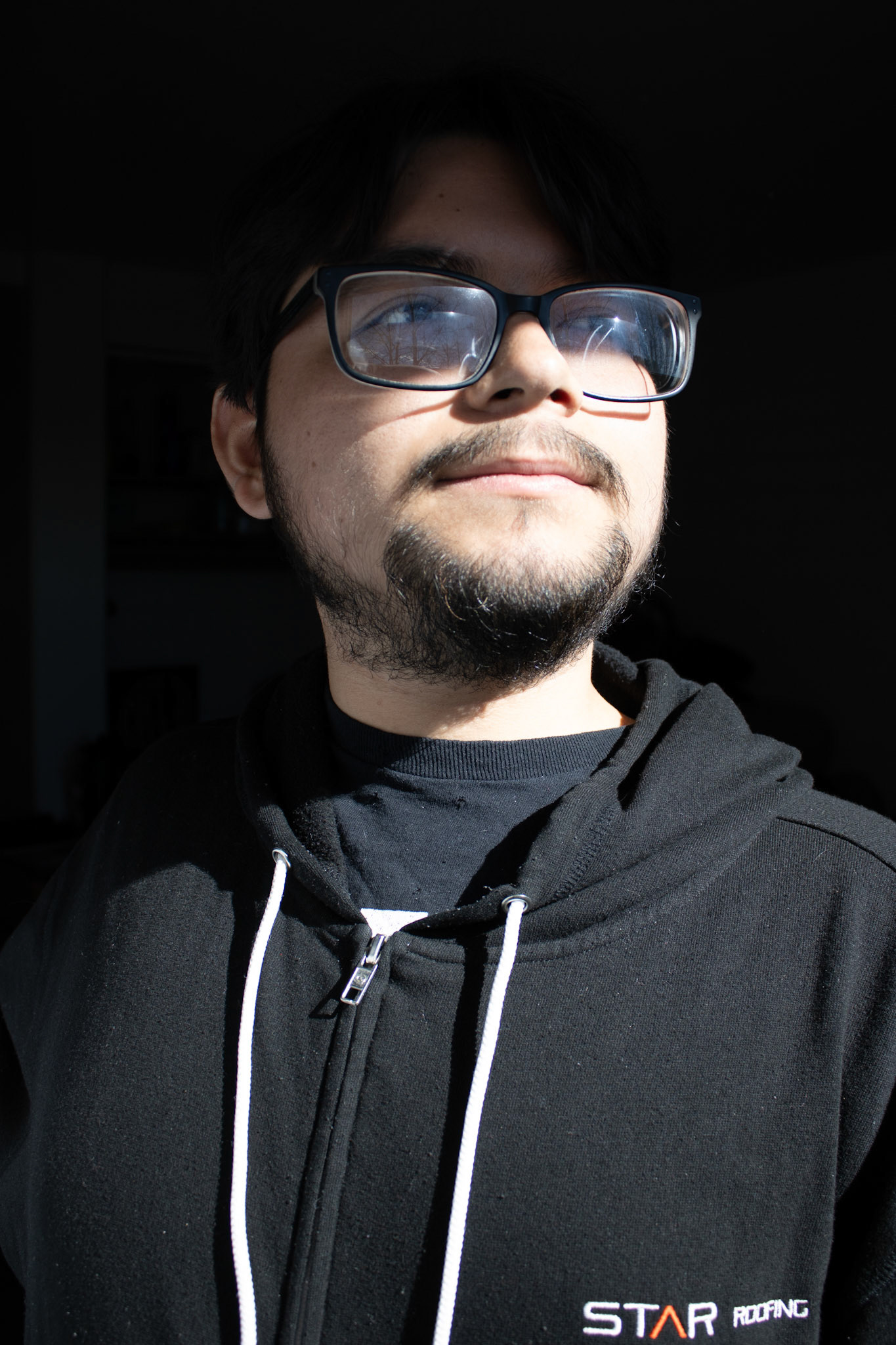 Man standing indoors. 