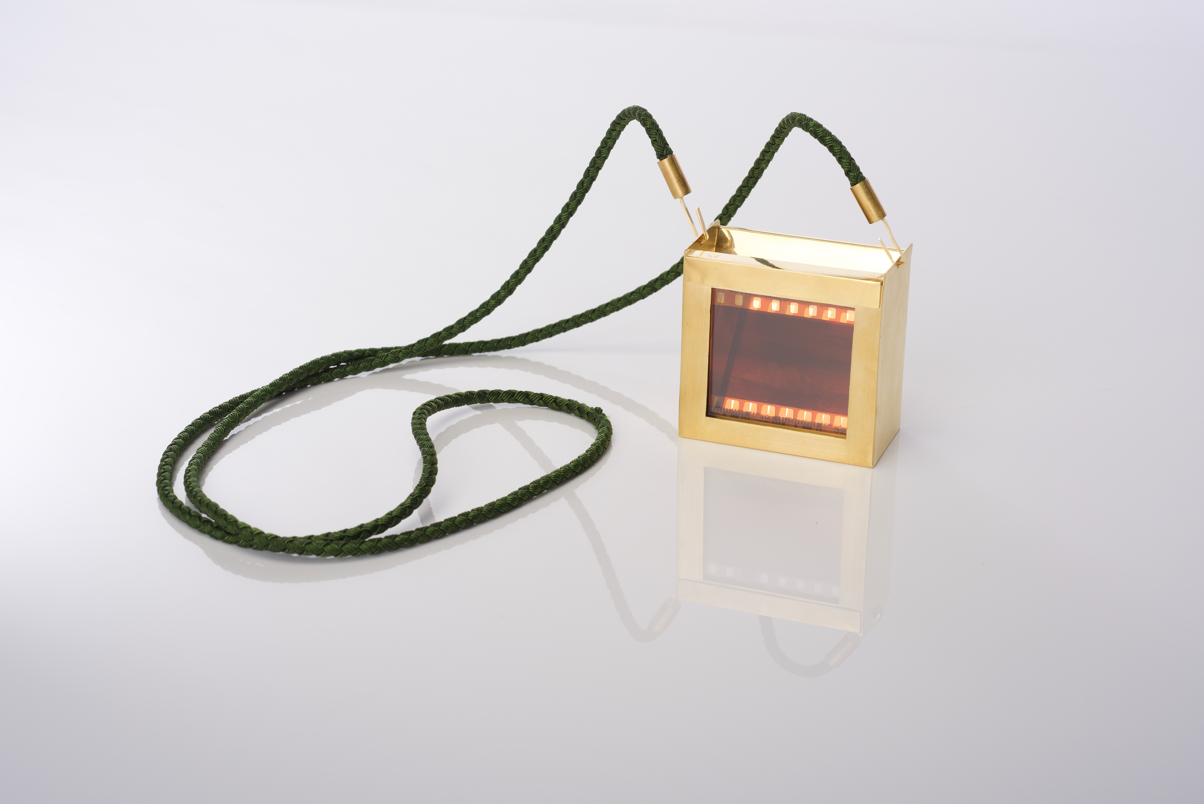 Brooch/Necklace - Gilded brass, photographic negative, glass, cork and synthetic thread