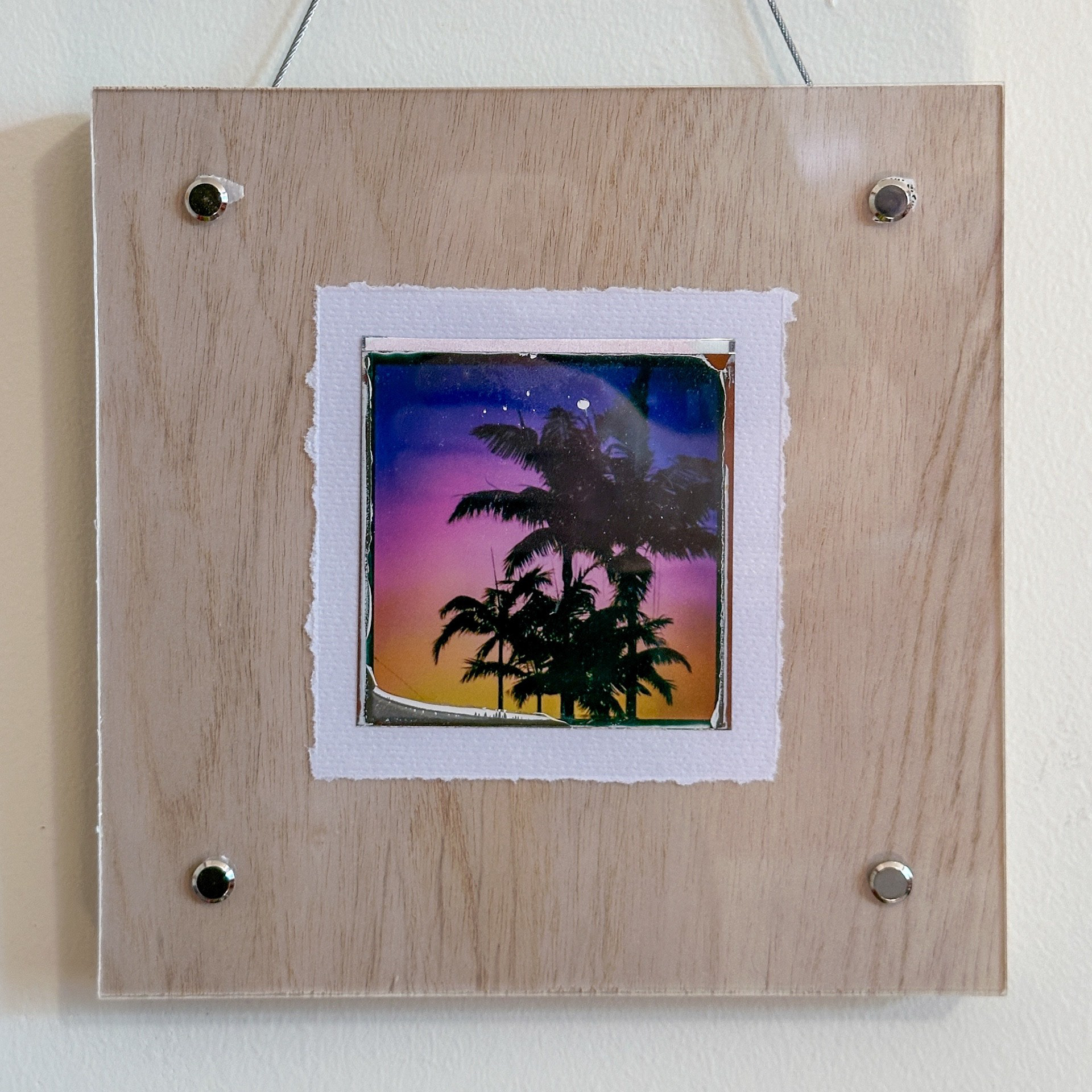 Noah Browning "Tropical Sunset," 2025. Polaroid slide on watercolor paper. 8 in × 8 in