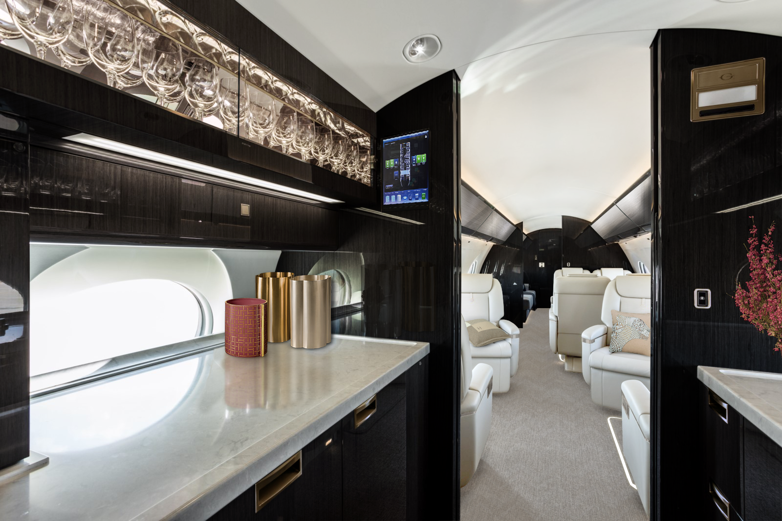 Gulfstream G650ER Kitchen with a cabinetry composed black wood panels.