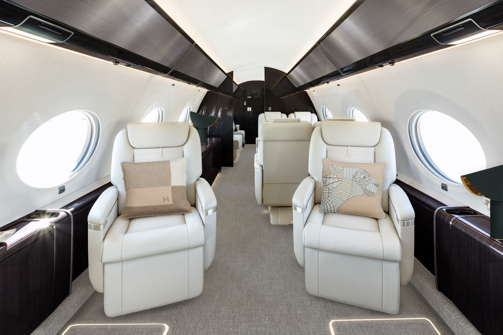 Gulfstream G650ER Lounge Area with a clear design, comfortable lighting and black wood panels