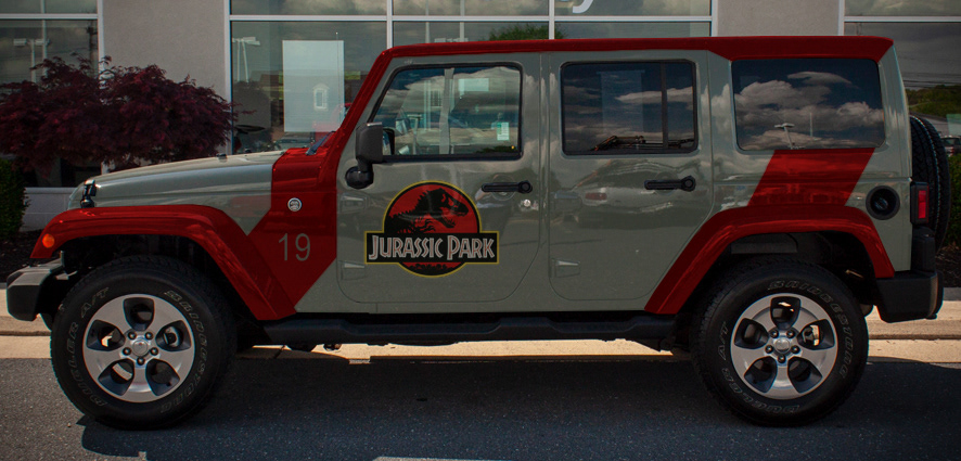 A photoshopped image of a Jeep made to look like a Jurassic Park vehicle.