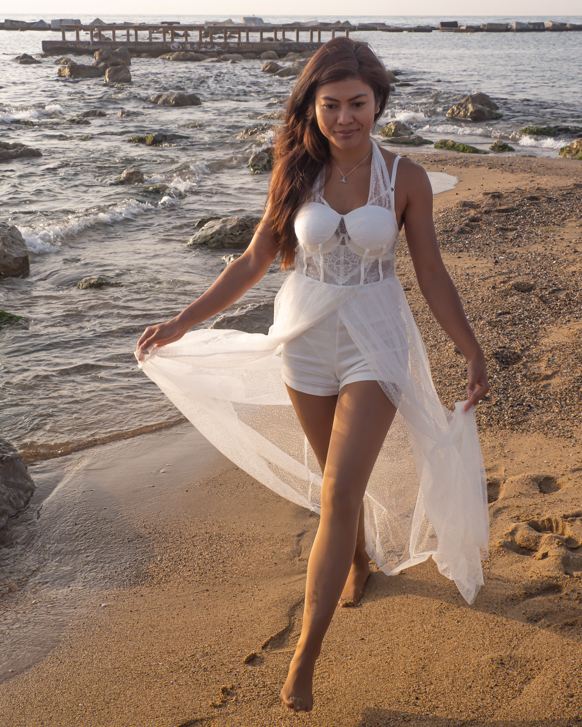 Azura Moktar walking on the beach