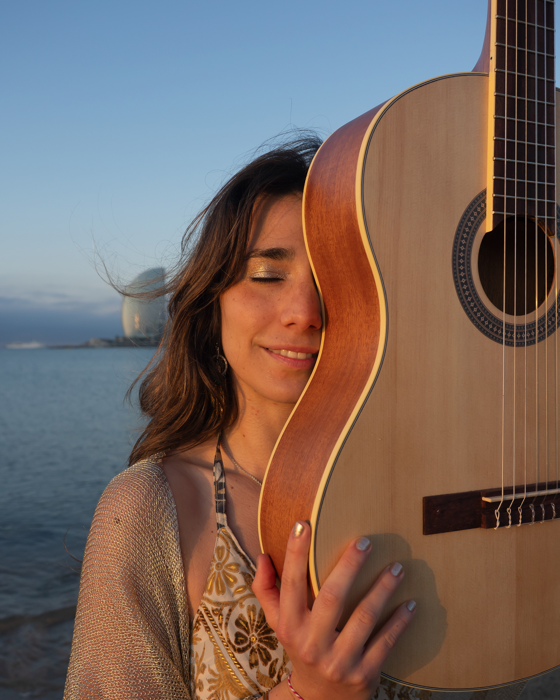 Spanish Singer-songwriter  Arual in Barcelona Beachwith her guita