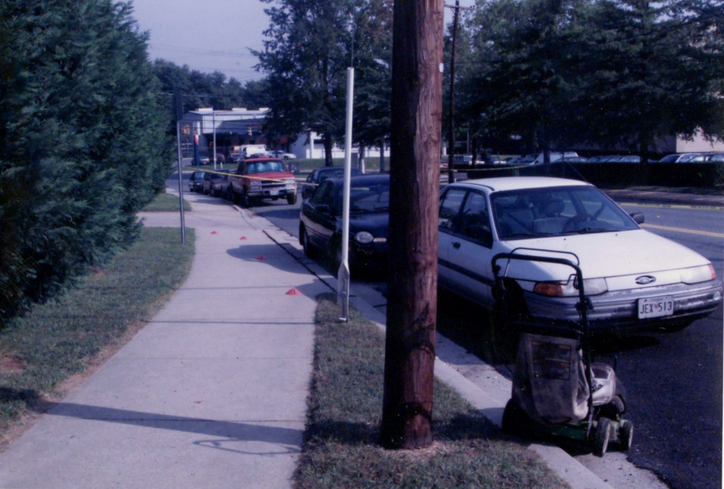 Lawn mower left behind after James L. "Sonny" Buchanan was shot. The cones indicate a blood trail left behind as he tried to run for help.