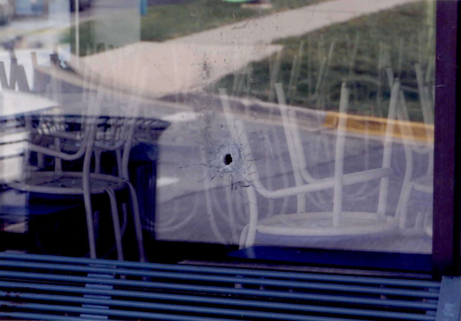 Bullet hole behind the bench where Sarah Ramos was killed.