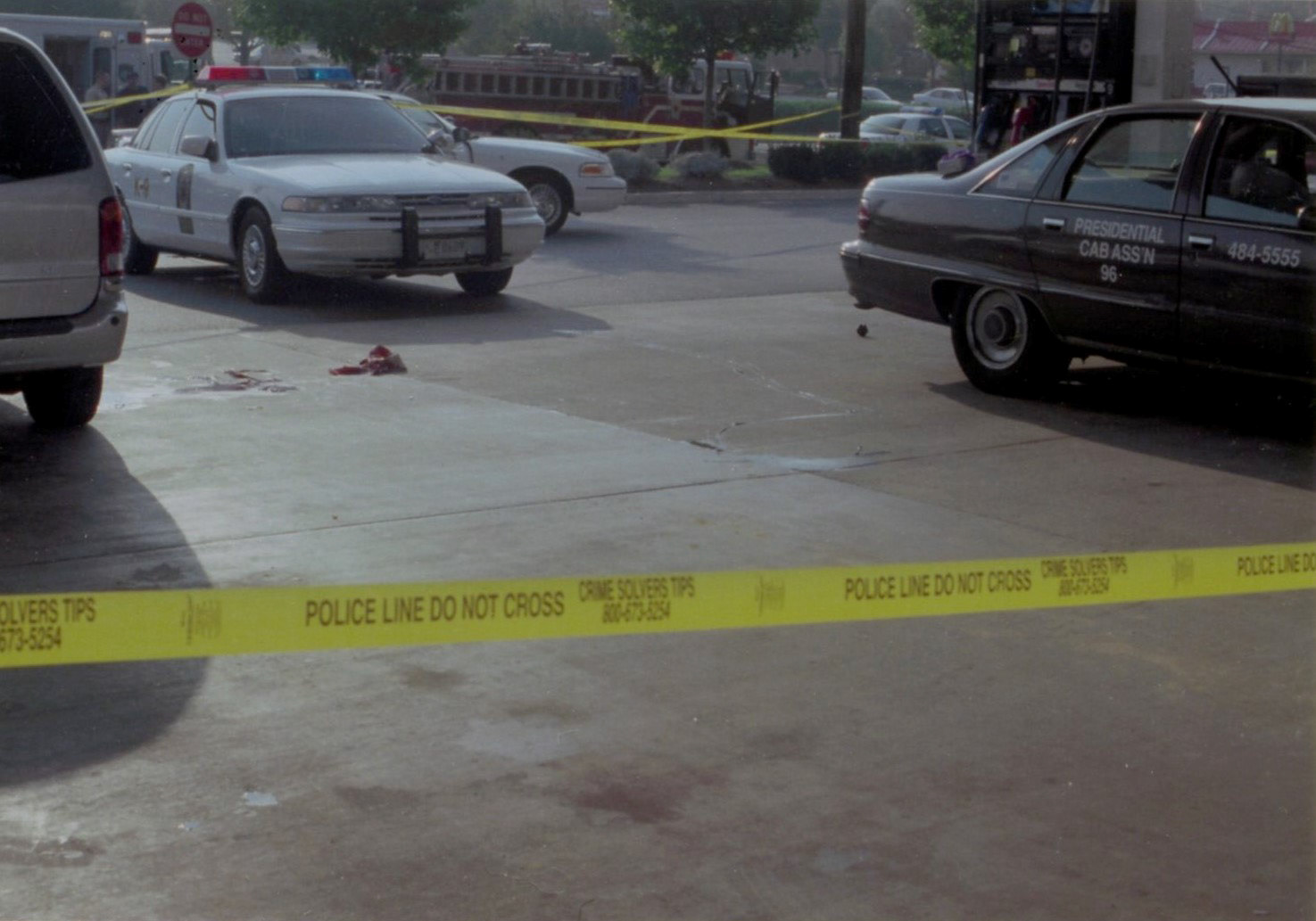 Walekar stumbled away from his taxi cab after being shot and collapsed next to a van across from his vehicle at the gas station