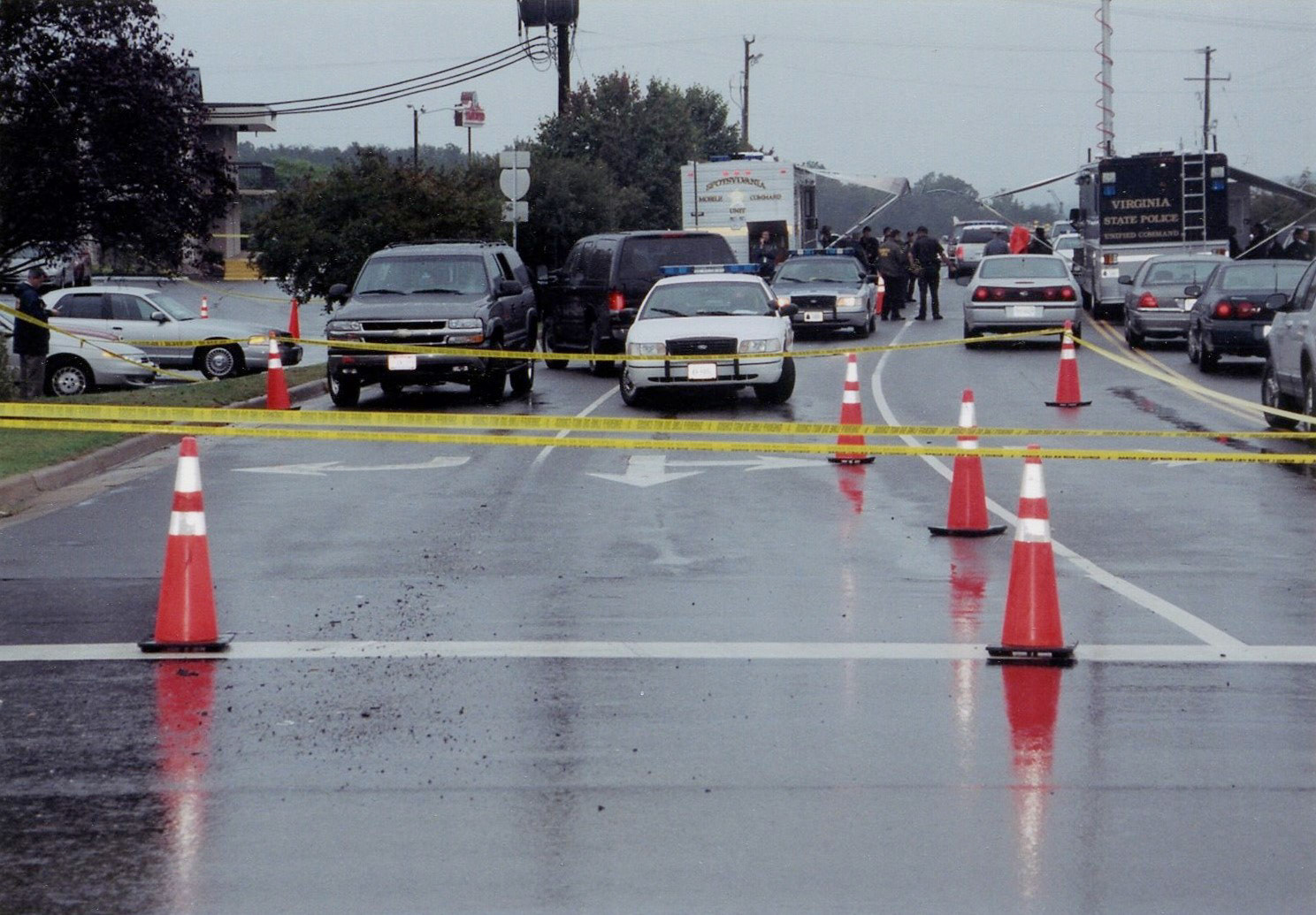 Law enforcement create a roadblock in the hopes of catching the killers.