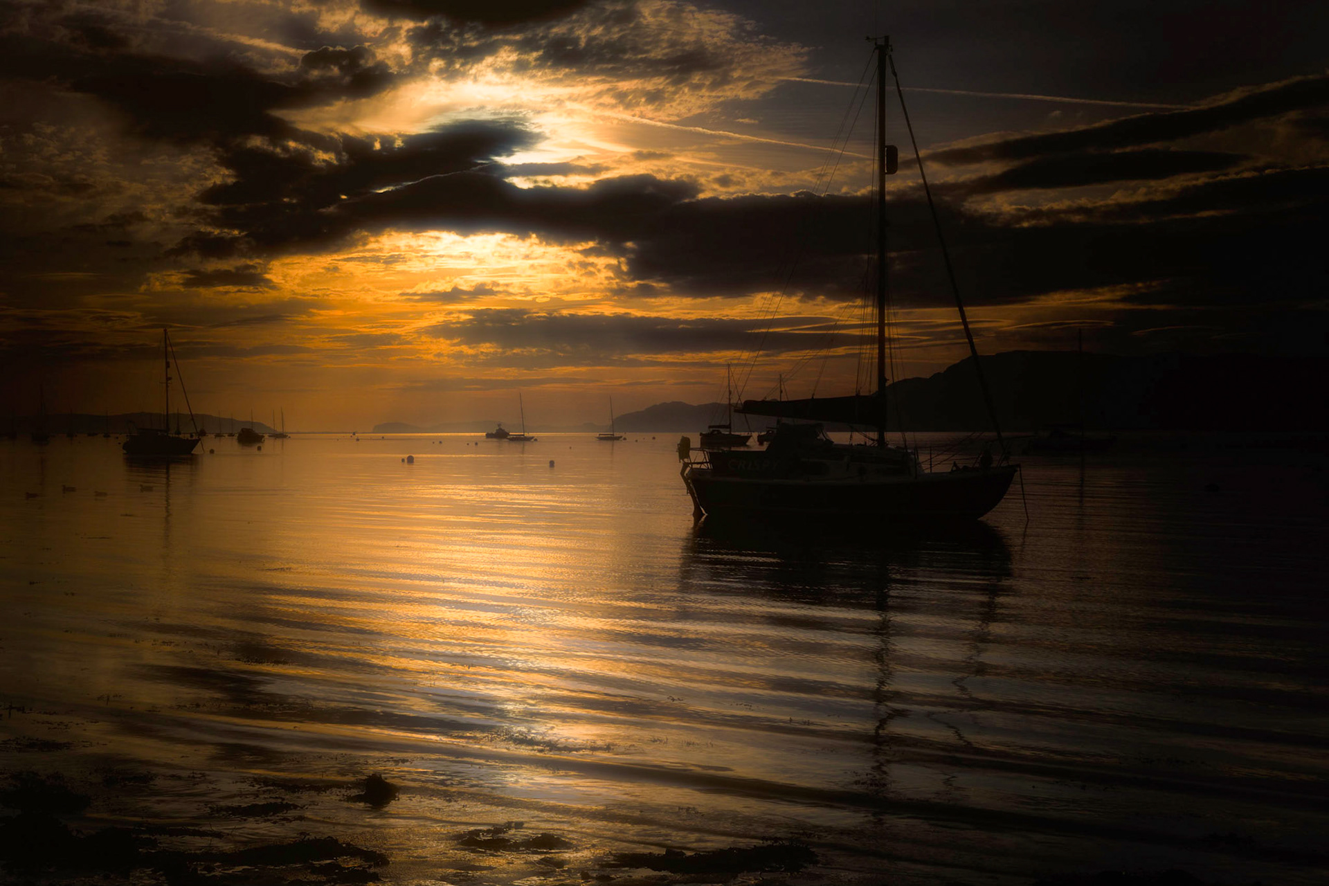 Sunrise over Menai Strait at Beaumaris Beach