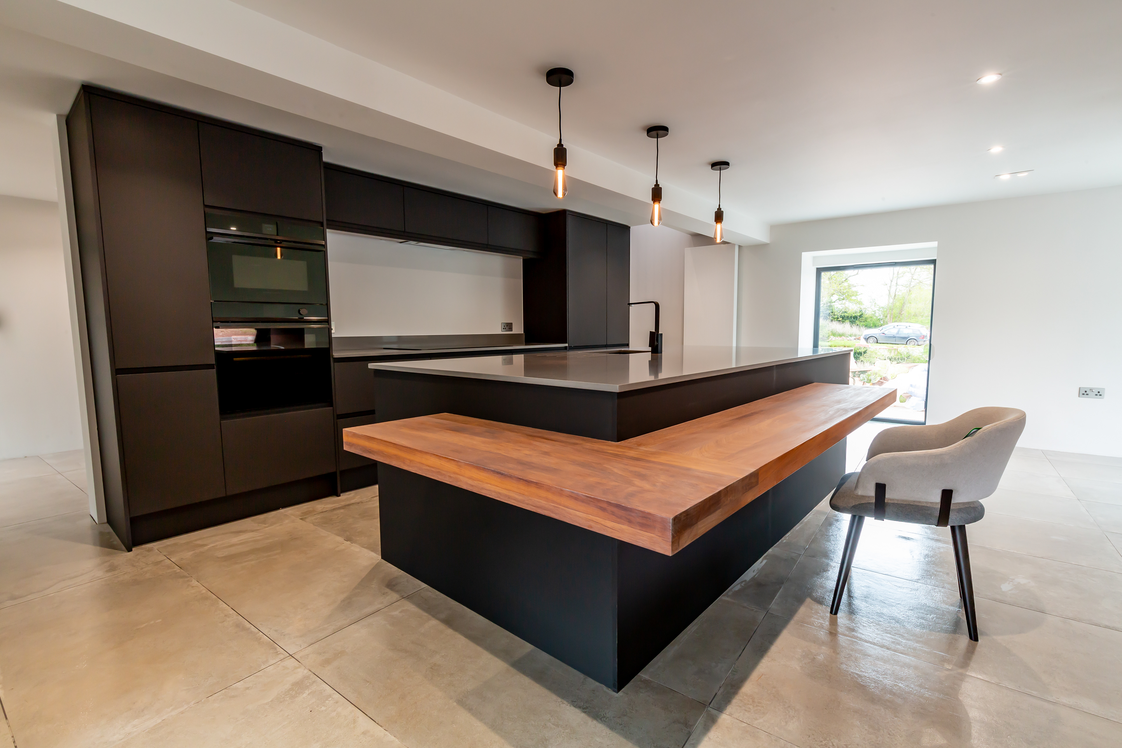 Modern kitchen units in a traditional farmhouse extension