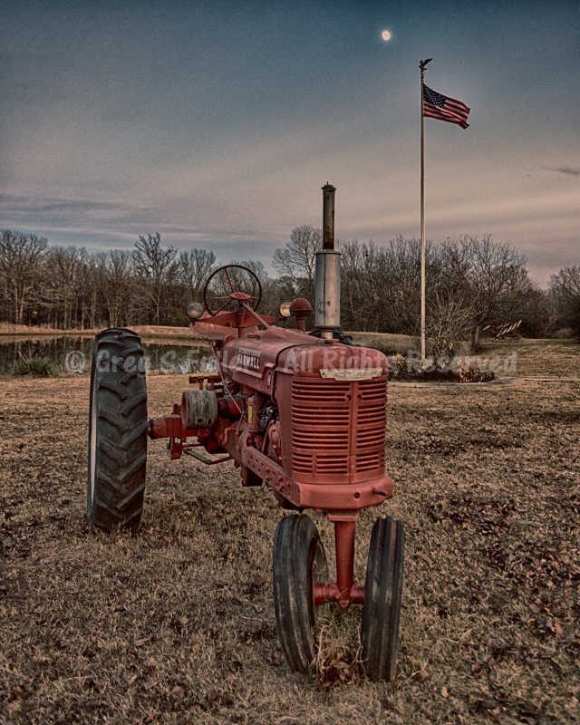 Vintage International Harvester Farmall Model H Tractor - Moonsetting over American Flag - Okmulgee, Oklahoma
