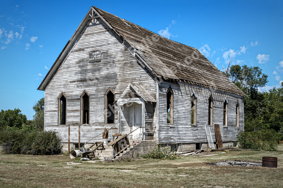 A church fallen into disrepair in a fading & waning prarie town - Gem, Kansas