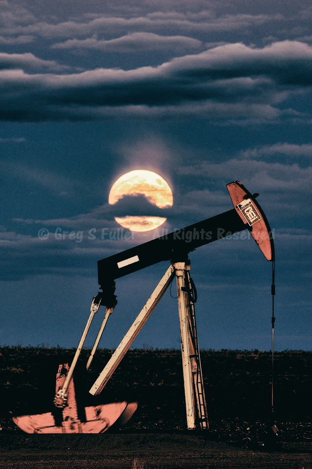 A Pumpjack Moonrise with a Golden Glowing Moon - Eastern Plains of Colorado