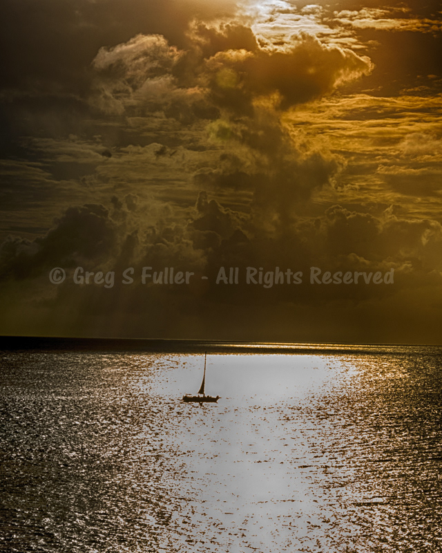 Sailing the Caribbean with Large Golden Billowy Cumulonimbus louds - Curacao