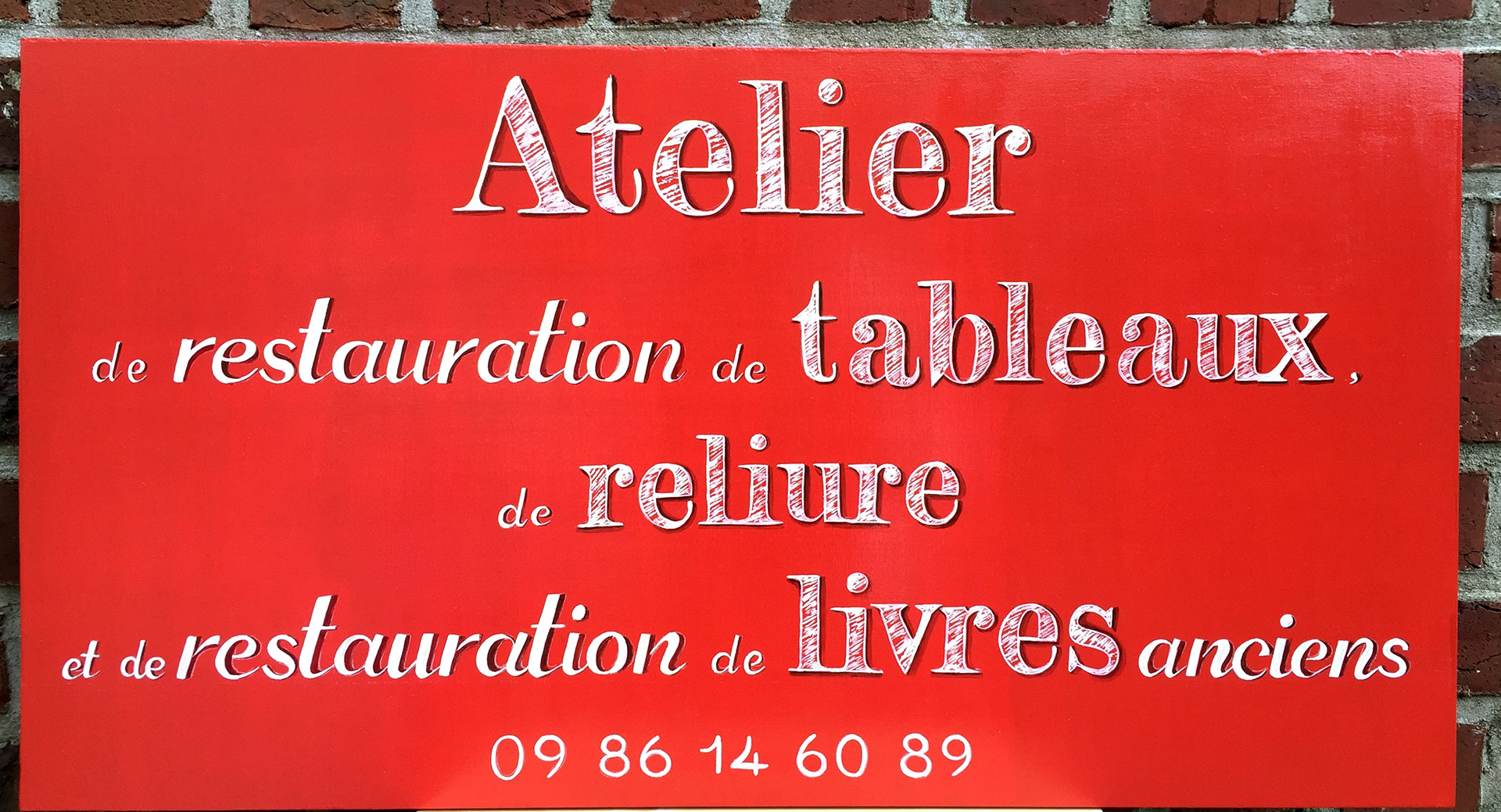 Lettrage publicitaire pour atelier d'artisans