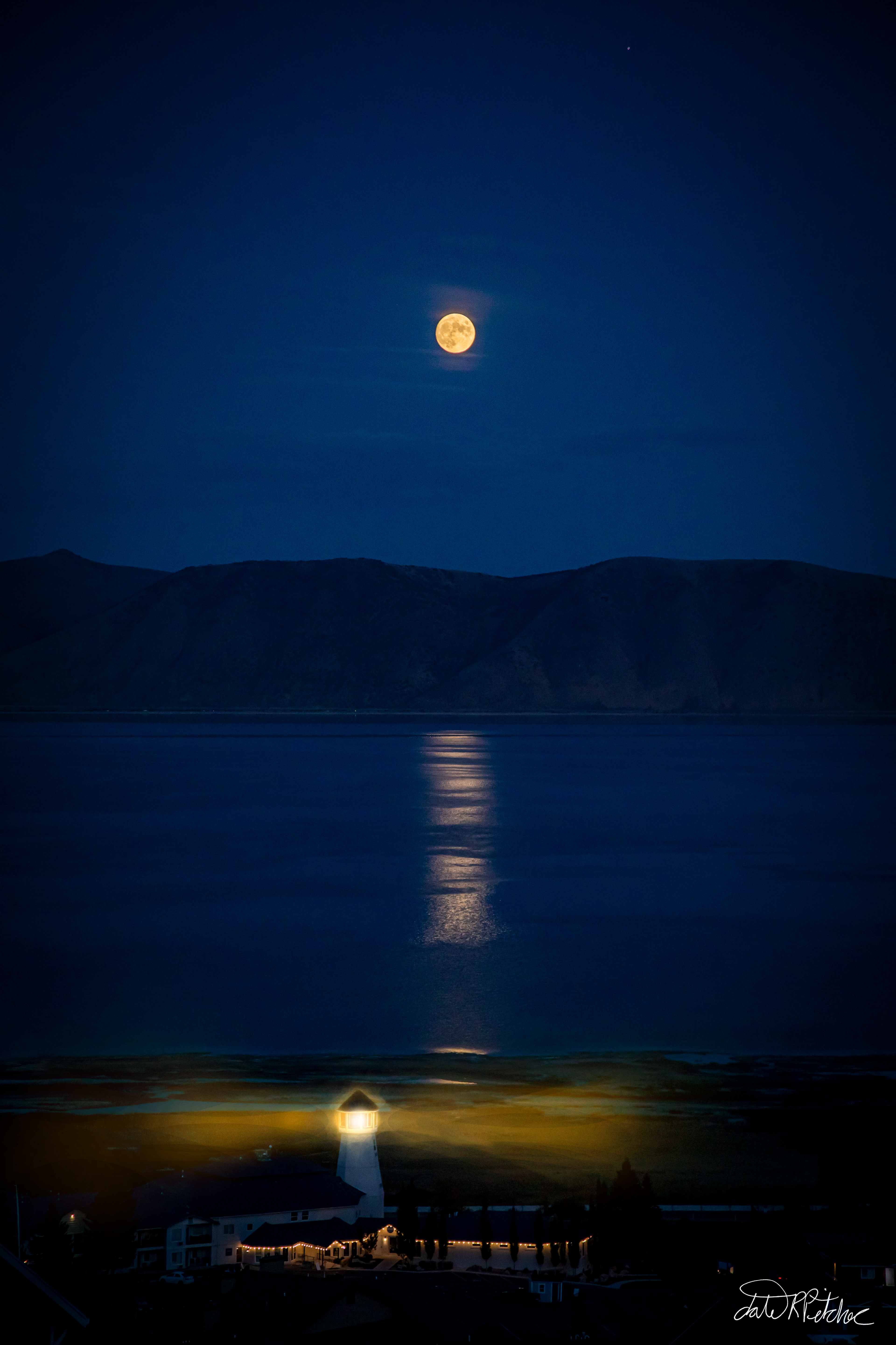 Bear Lake Moonscape - I was hoping to take pictures of the stars this night until I noticed the full moon reflecting off the lake. I had to capture it with a dormant lighthouse that I brought back to life through photoshop!
