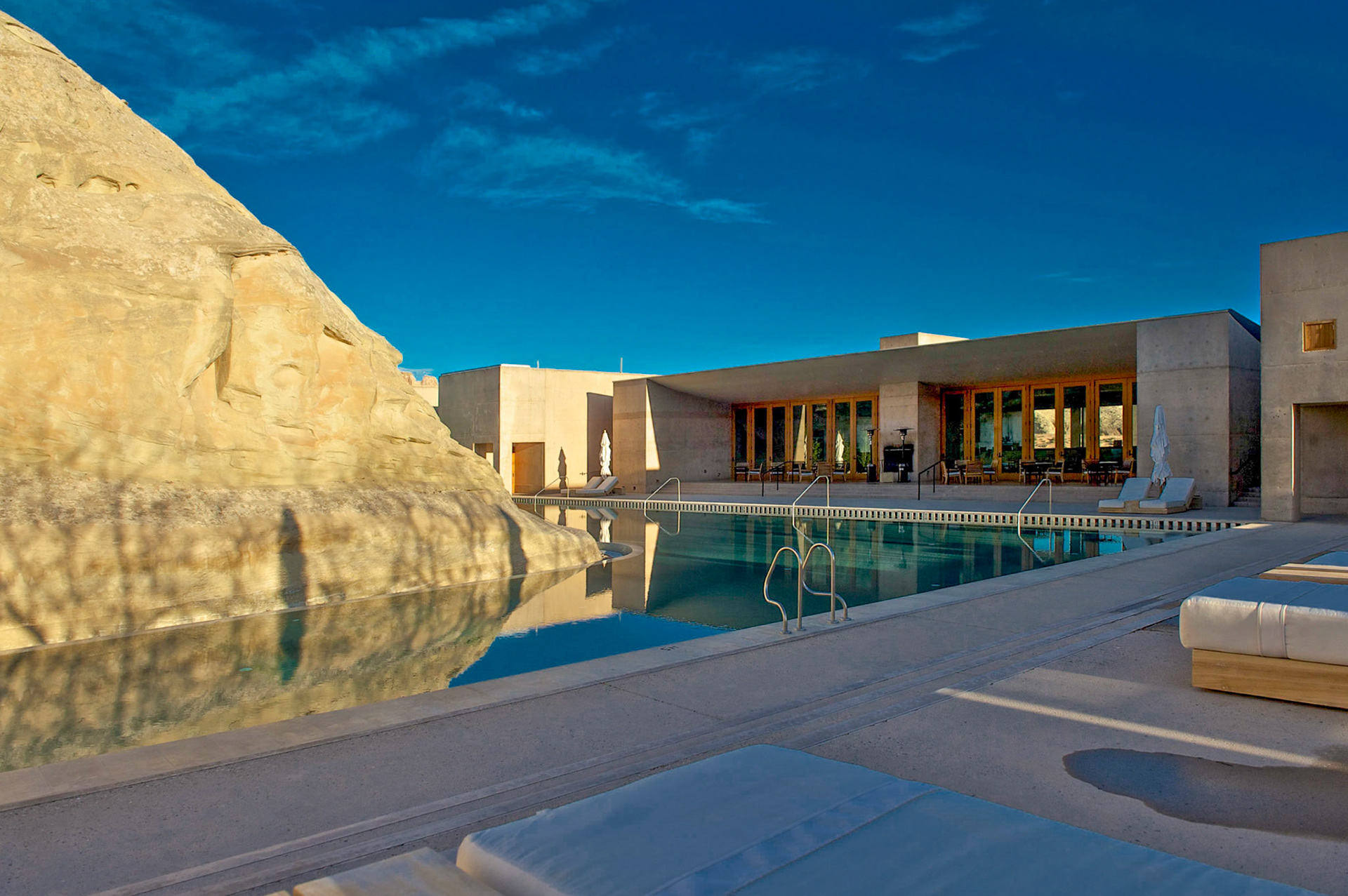 infinity pool and restaurant are built around the terrain