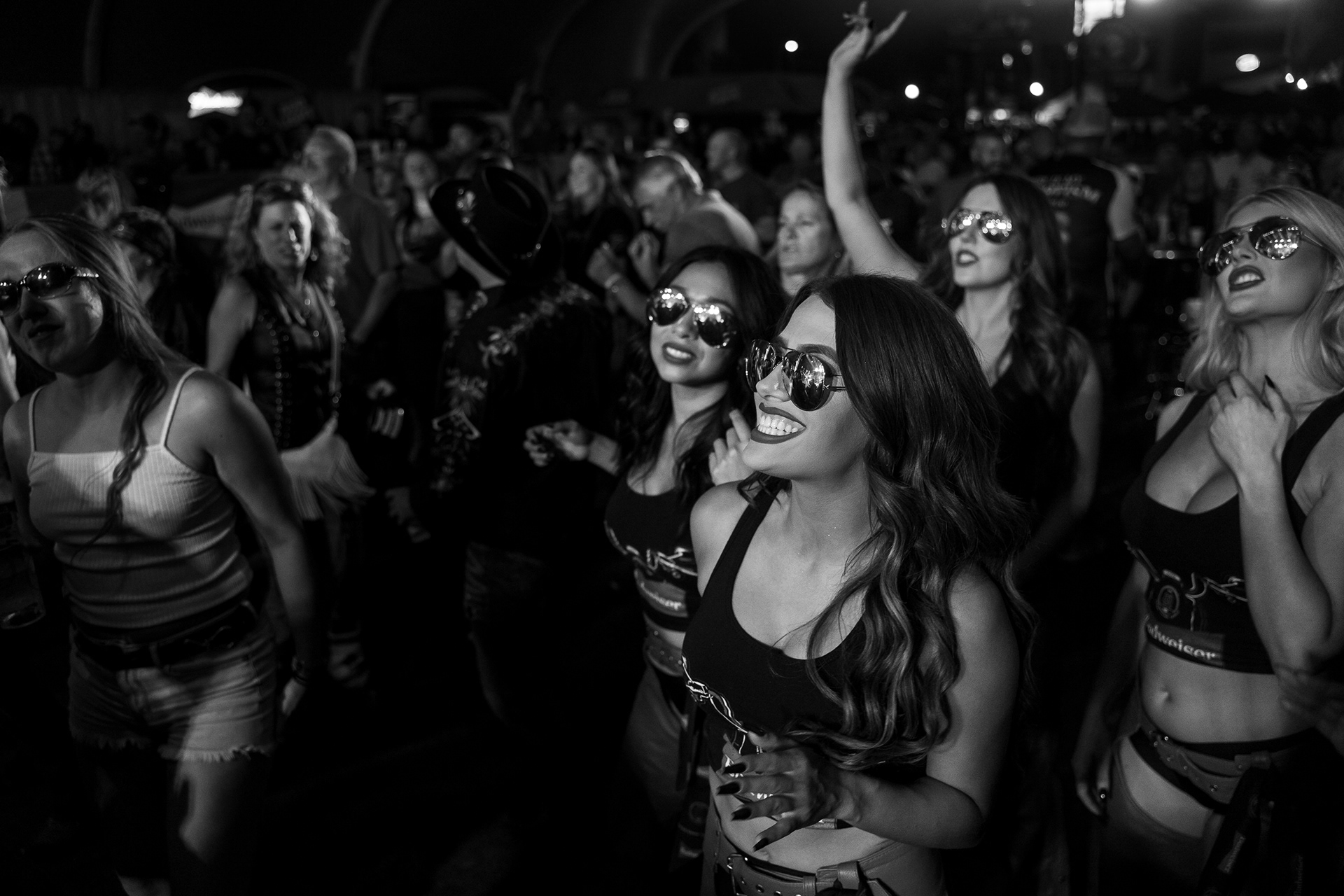 The Bud Girls dance in the crowd at the Loud American during the fourth day of the 81st Sturgis Motorcycle Rally in Sturgis, South Dakota. 08.09.21.