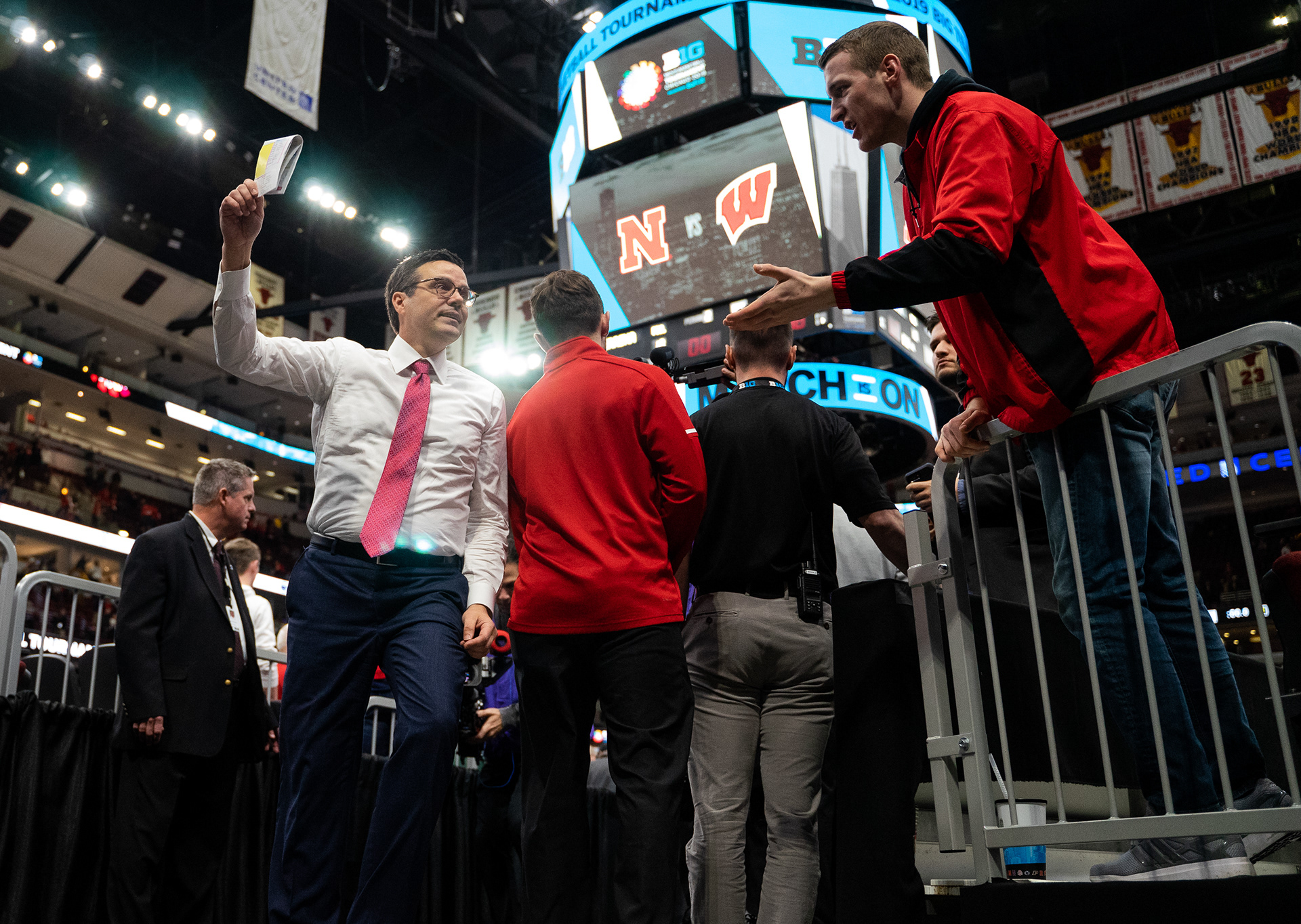 Former Nebraska head coach Tim Miles waves to fans as he walks off the court following Nebraska's 62-66 loss to Wisconsin at the United Center in Chicago, Illinois. 03.15.19.