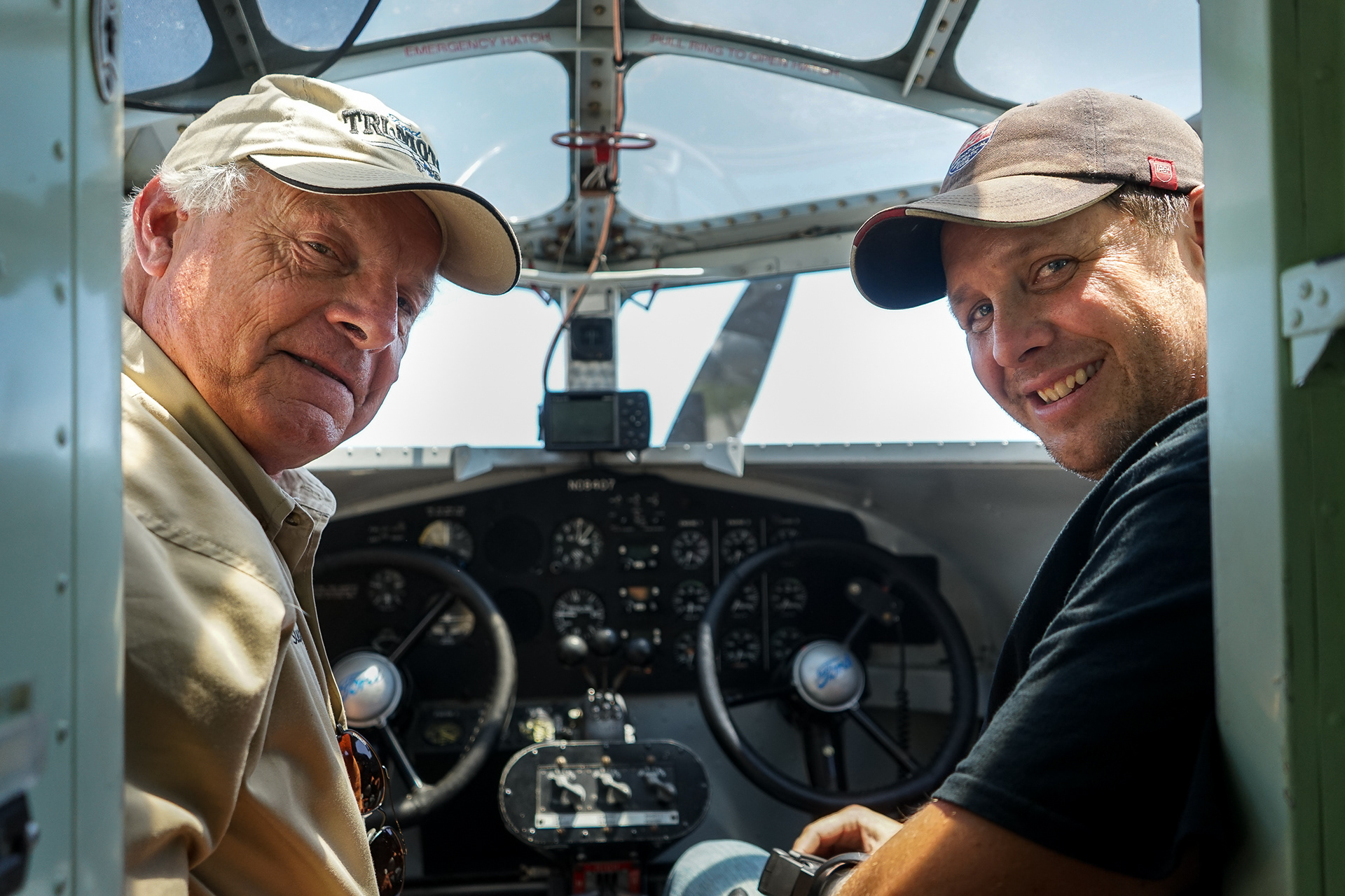 Pilots Bill Sleeper (left) and Jason Schindler pose for a portrait while sitting in the cockpit of a restored 1929 Ford TriMotor, the world's first mass-produced luxury commercial plane, at O'Neill Municipal Airport outside O'Neill, Nebraska. 06.14.2018.