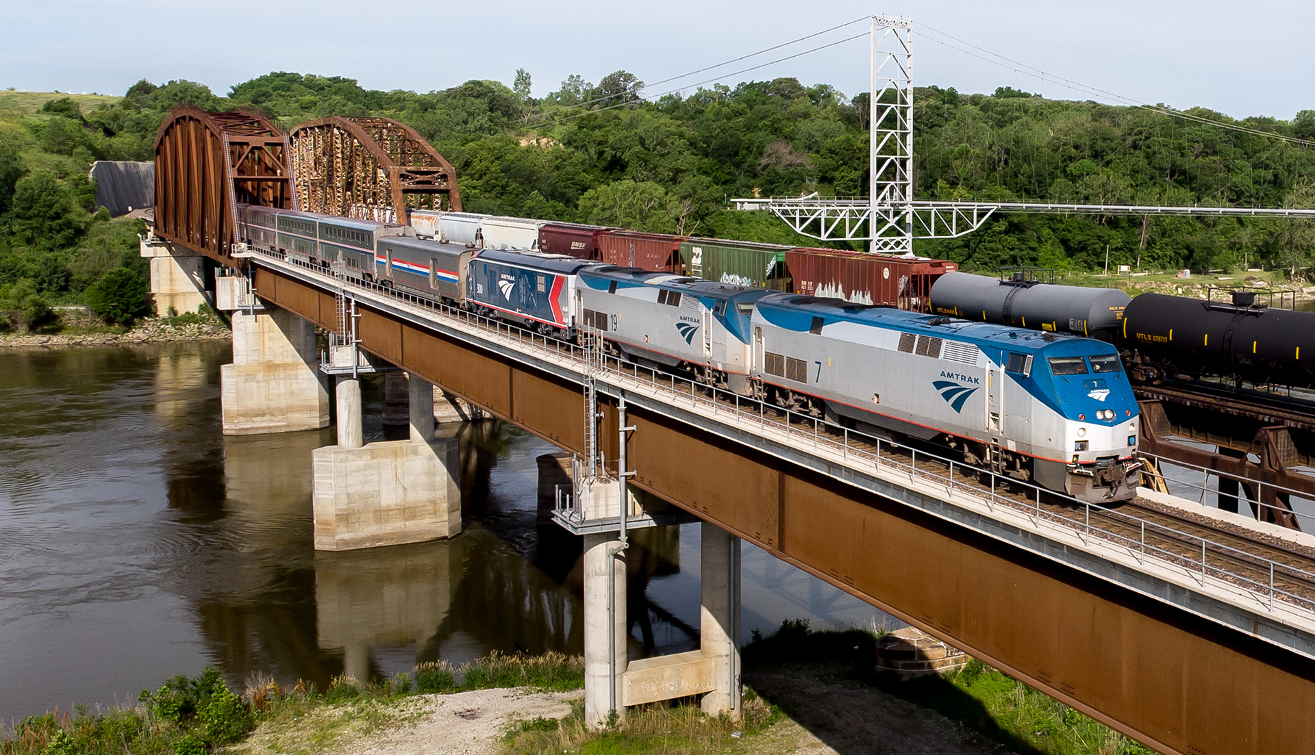 Amtrak P42DC #7, #19, and a Siemens ALC-42 #300 lead the #6 California Zephyr across the Missouri River outside Plattsmouth, Nebraska. The ALC-42 is the first of Amtrak's new Siemens locomotives to be delivered. It will be set aside for a media event in Chicago on June 15th before continuing on east where it will go under testing over the summer on Amtrak's Northeast Corridor. 06.14.21.