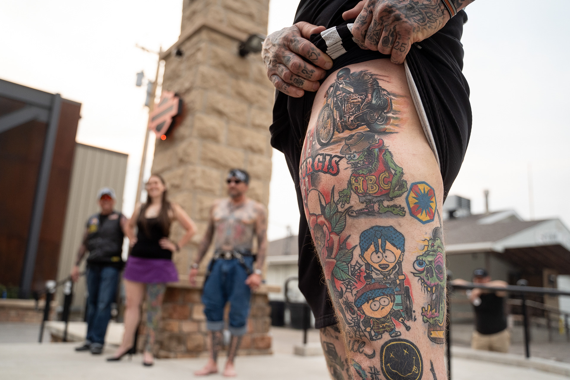 The winner of “Best in Show” at the tattoo contest shows off their winning tattoo along with the other finalists during the fifth day of the 81st Sturgis Motorcycle Rally in Sturgis, South Dakota. 08.09.21.