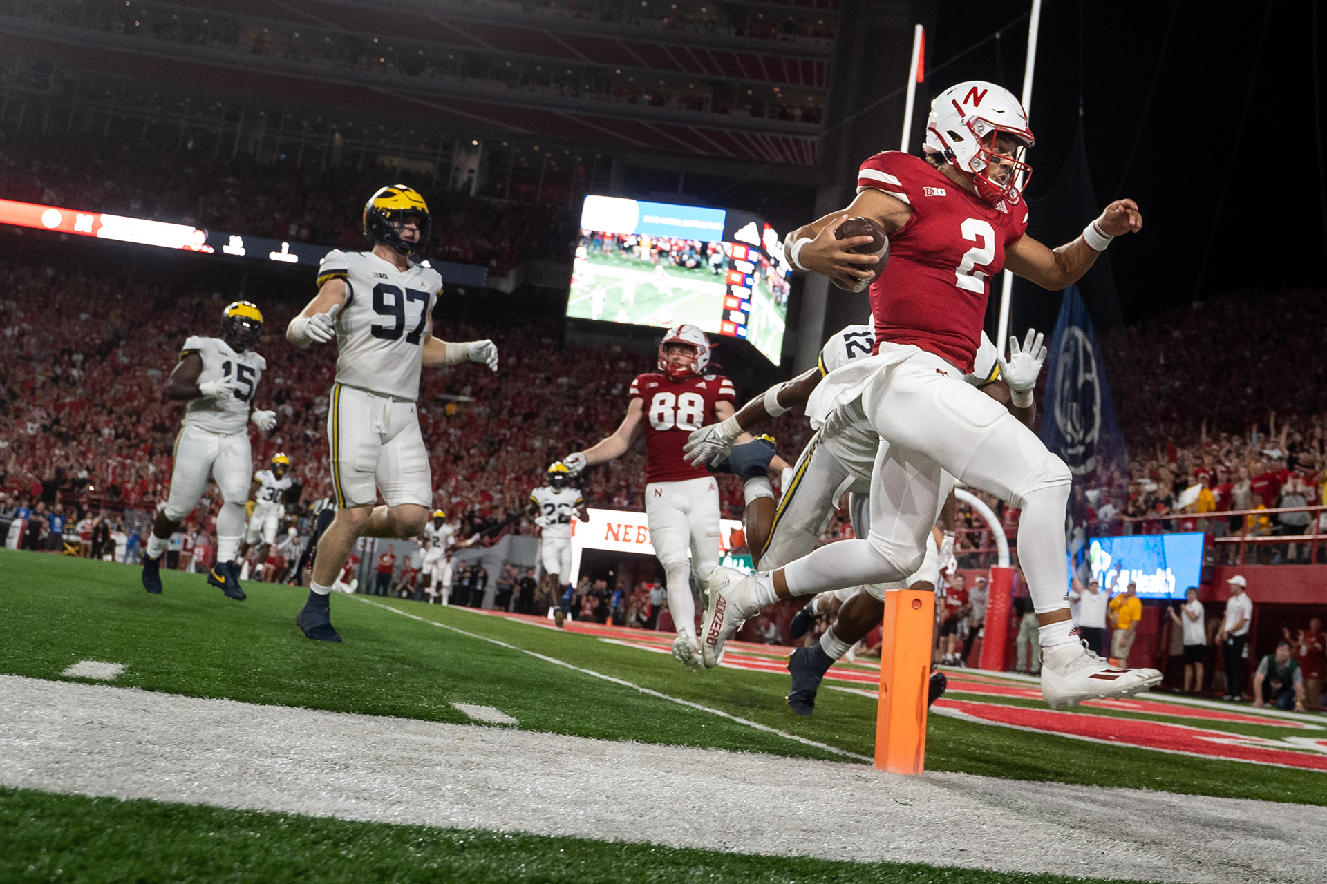 Nebraska Cornhuskers quarterback Adrian Martinez (2) scores a touchdown against the Michigan Wolverines in the third quarter at Memorial Stadium. 10.09.21.