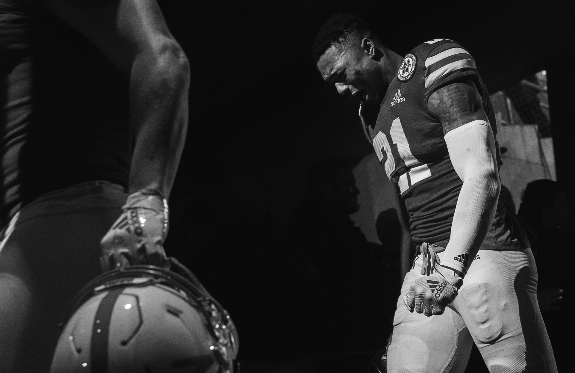 Nebraska's Lamar Jackson (21) cries as he walks off the field following the 27-24 loss to Iowa at Memorial Stadium in Lincoln, Nebraska. 11.29.19.