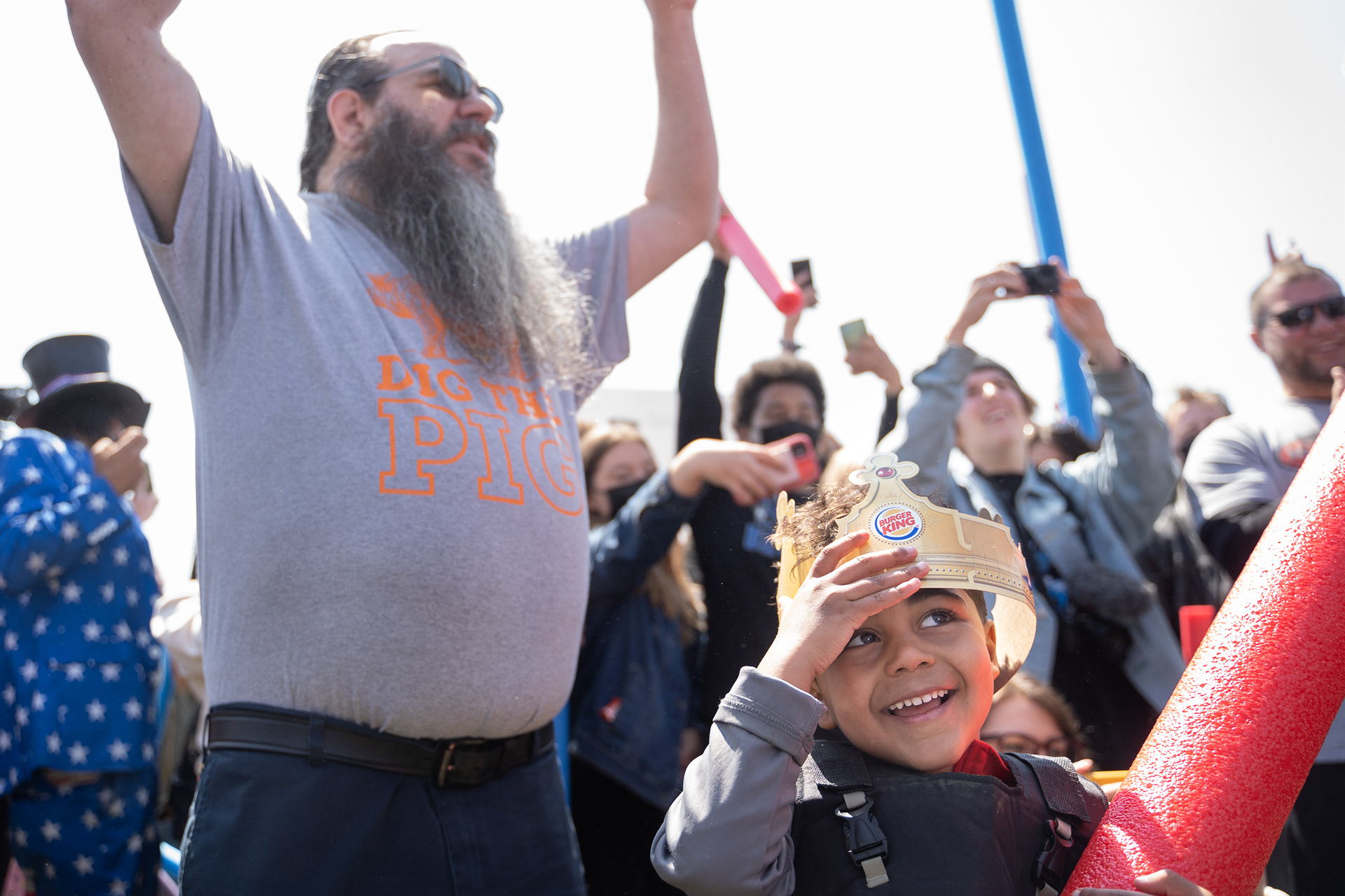 Spectators and participants cheer on 5-year-old Joshua Vinson Jr. of Lincoln (bottom right) after his win during the 2021 Josh Fight at the Air Park Green Area in Lincoln, Nebraska. 04.24.21.