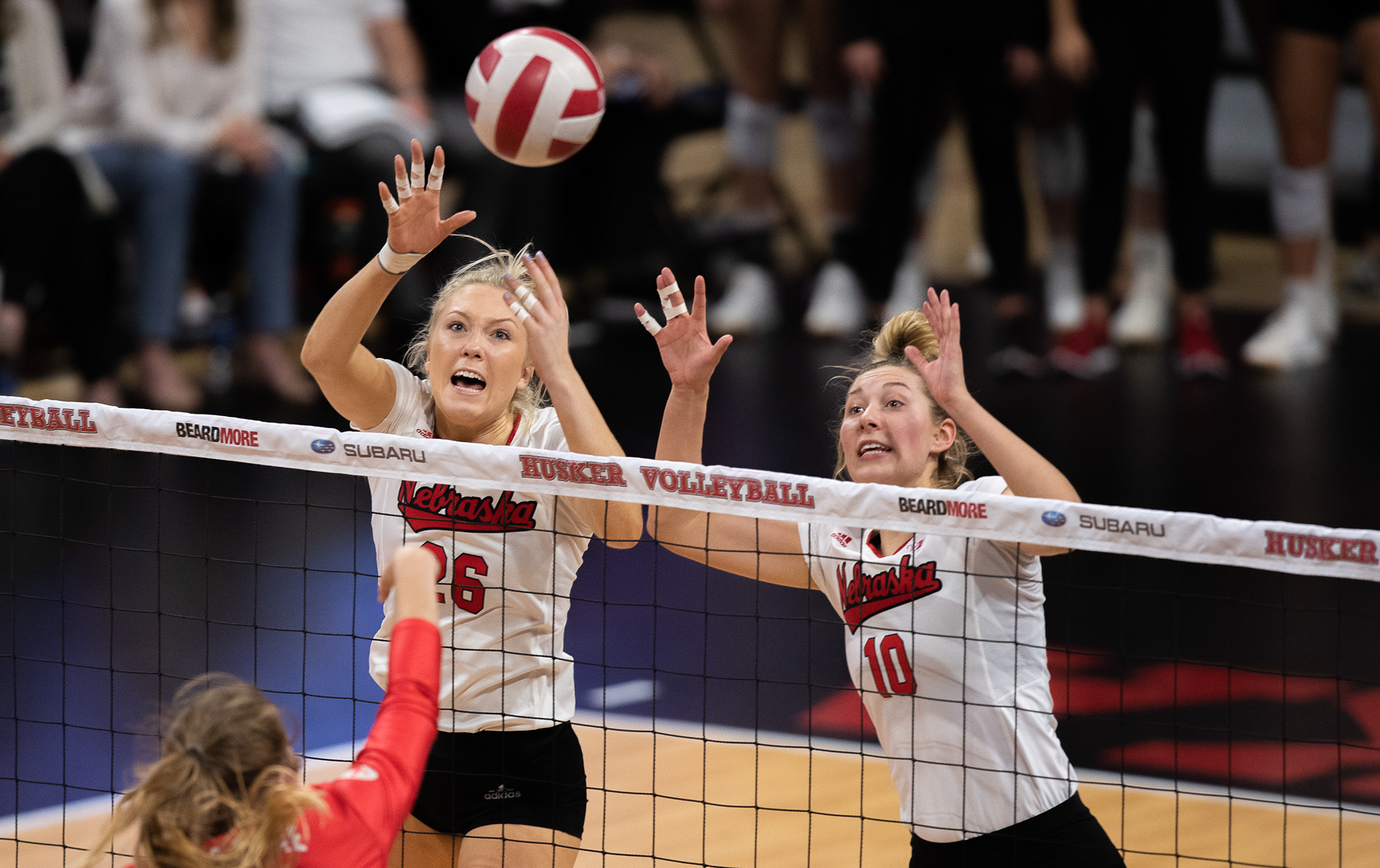 Nebraska's Lauren Stivrins (26) and Madi Kubik (10) attempt to block the ball during the match against Ohio State at the Bob Devaney Sports Center in Lincoln, Nebraska. 11.30.19.