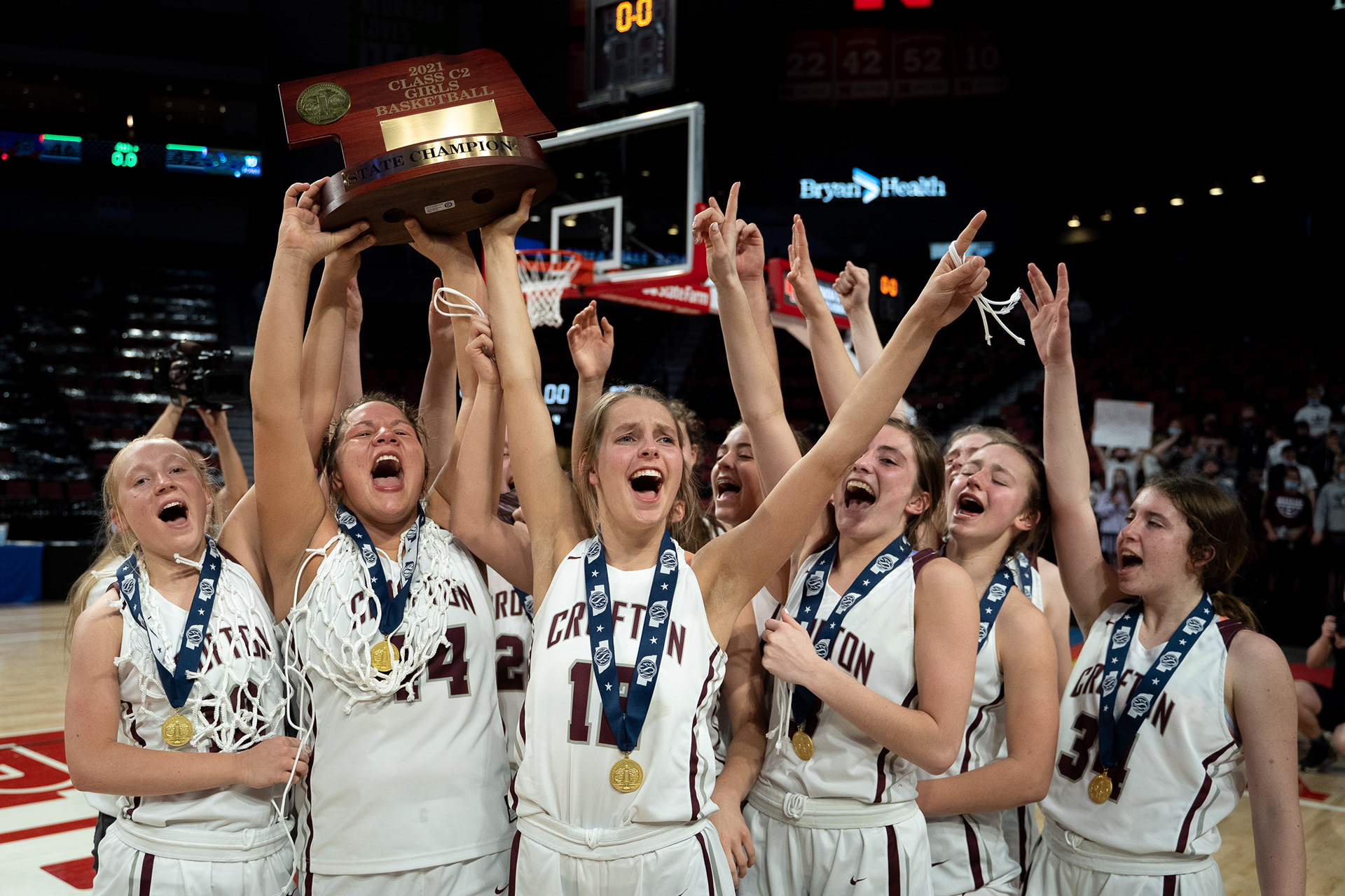 The Crofton Lady Warriors hoist their state championship trophy after their win over Ponca at Pinnacle Bank Arena in Lincoln, Nebraska. 03.06.21.