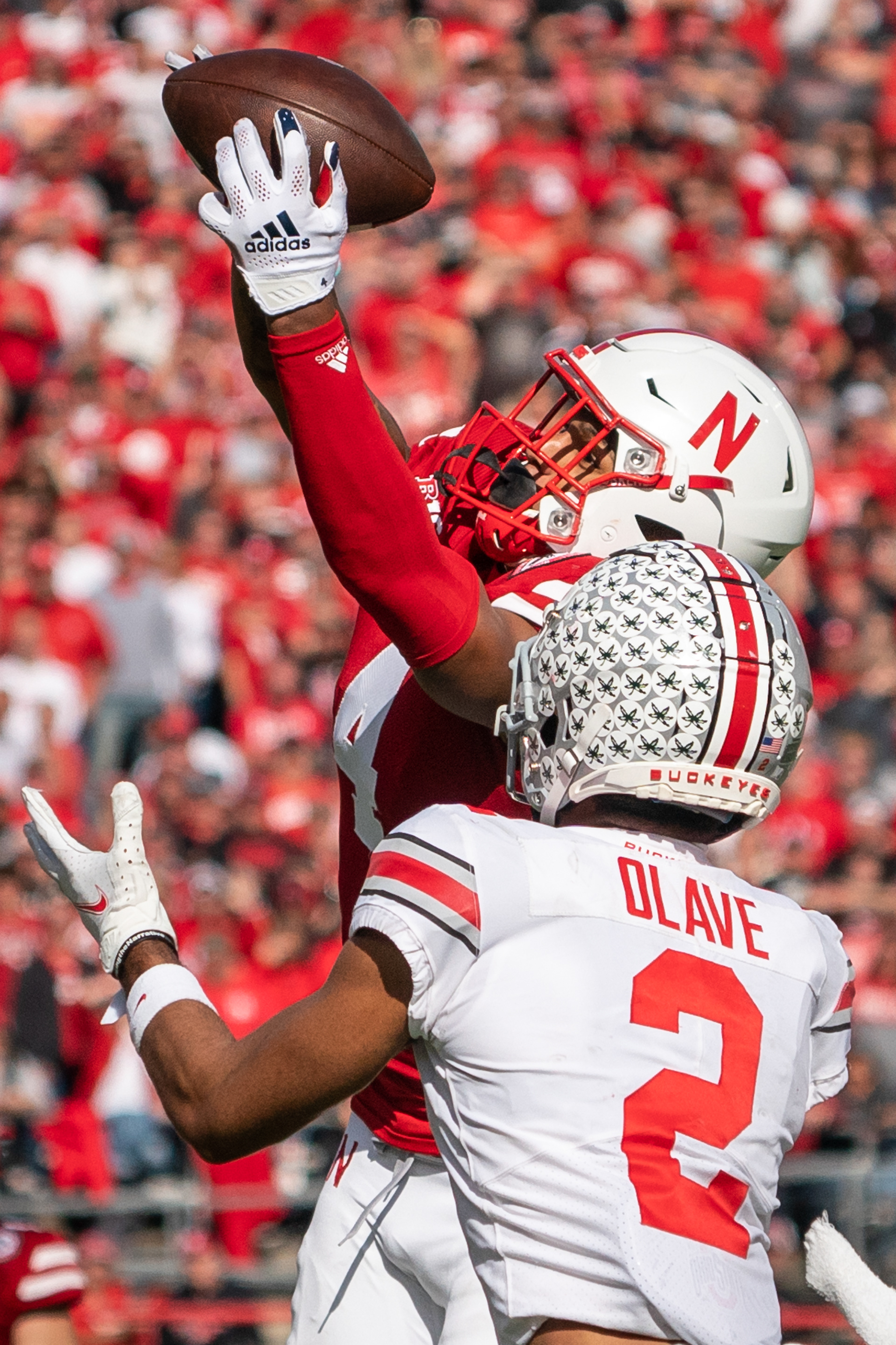 Nebraska Cornhuskers safety Myles Farmer (4) intercepts a pass intended for Ohio State Buckeyes wide receiver Chris Olave (2) during the third quarter at Memorial Stadium. 11.06.2021.