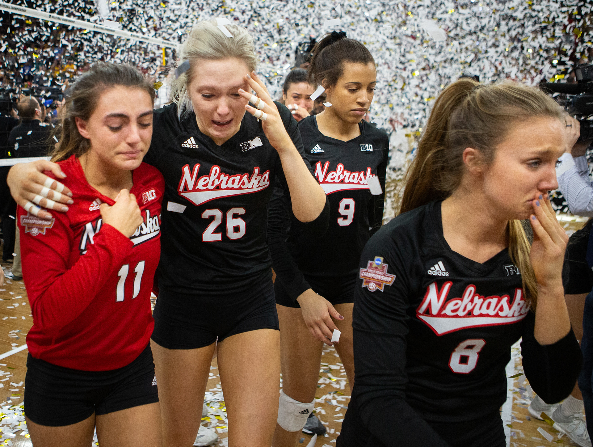 Nebraska's Kenzie Maloney (11), Lauren Stivrins (26), Capri Davis (9) and Brooke Smith (8) emotionally walk off the court after falling to Stanford in the NCAA Volleyball National Championship at the Target Center in Minneapolis, Minnesota. 12.15.18.