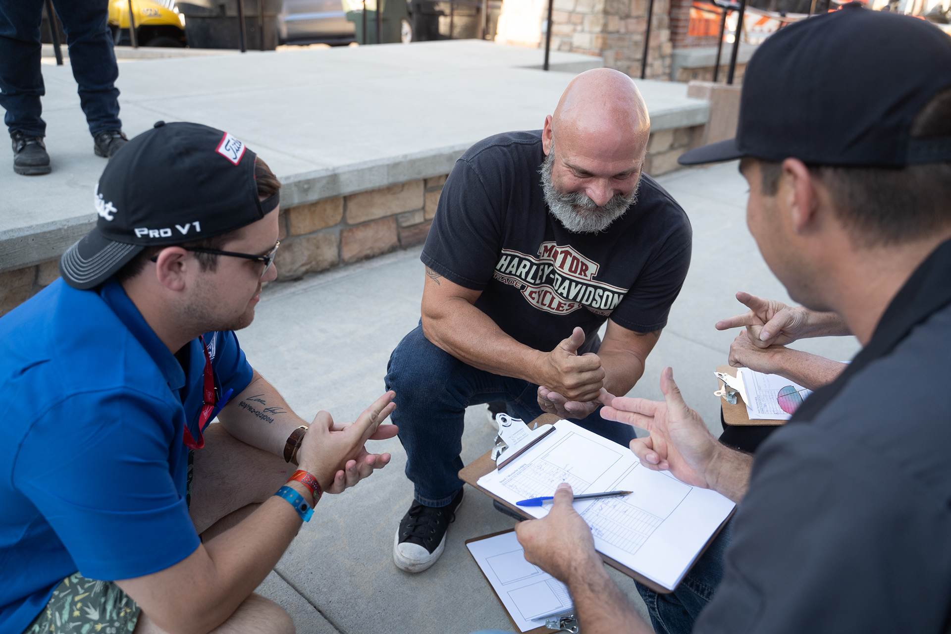 Judges play rock, paper, scissors during The Mustache and Beard Contest at the Harley Davidson Rally Point during the sixth day of the 81st Sturgis Motorcycle Rally in Sturgis, South Dakota. 08.11.21.