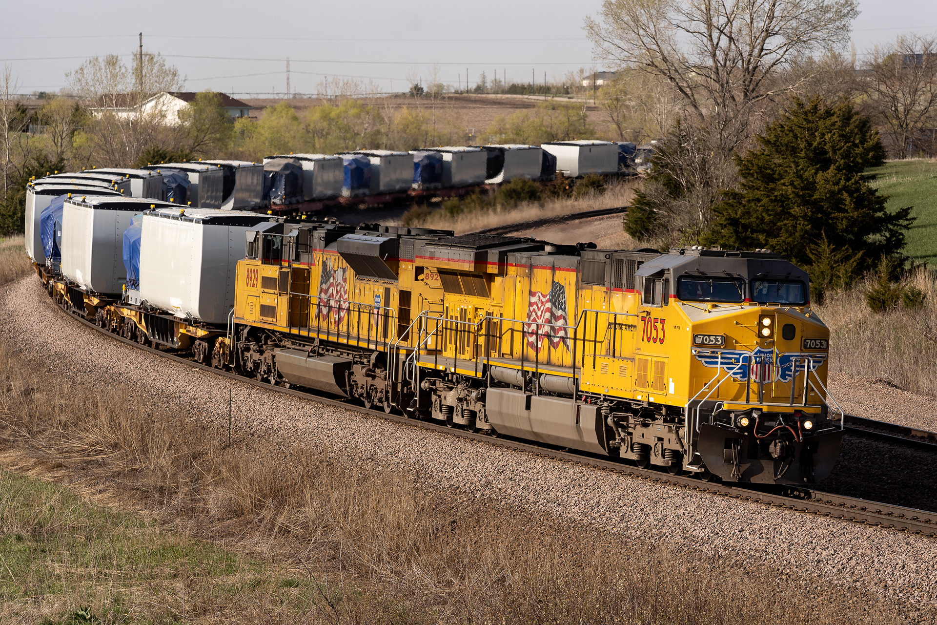 Union Pacific C44ACM #7053 leads a train with windmill parts on the St. Joseph Sub outside Firth, Nebraska. 04.25.21.